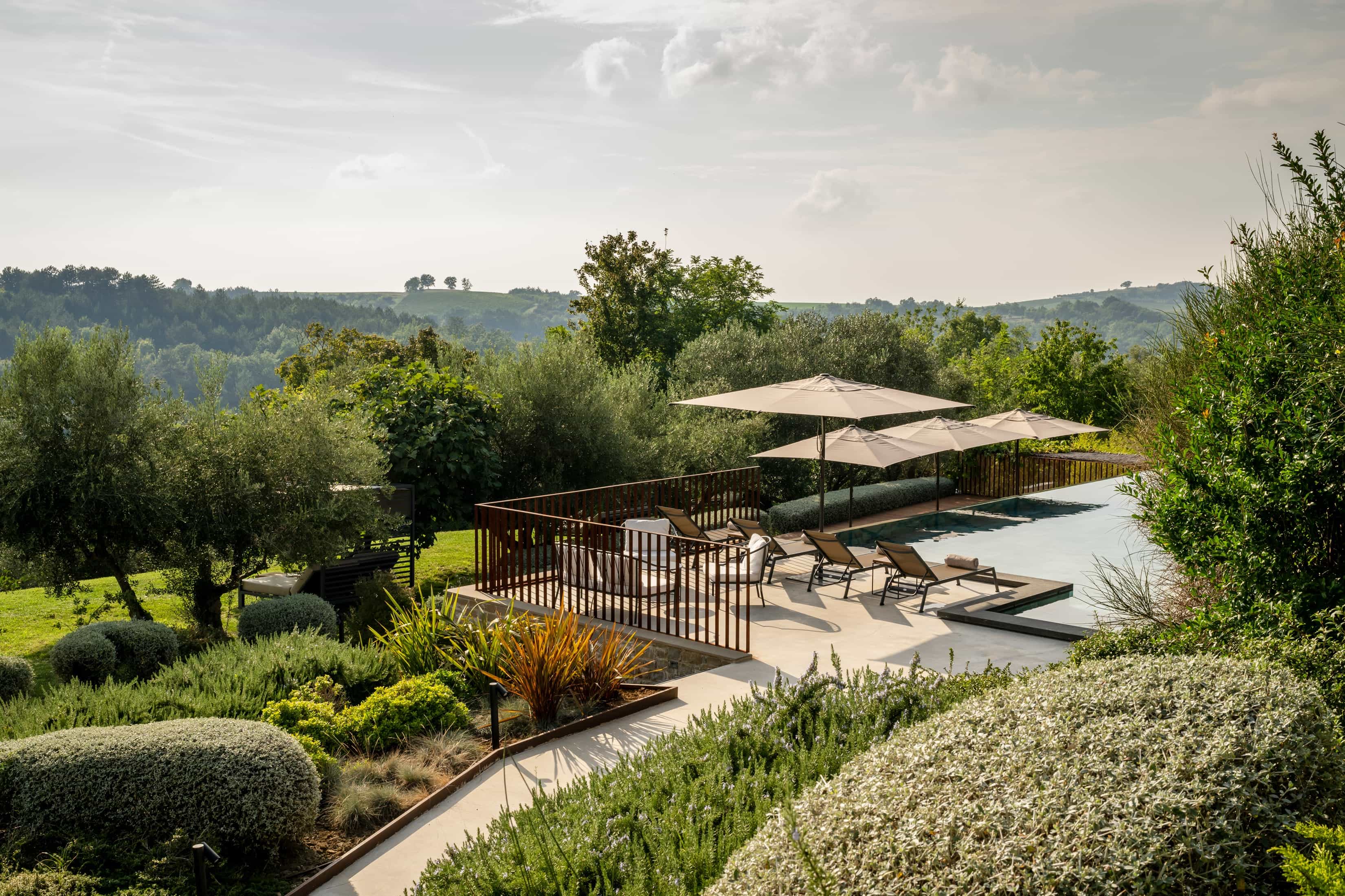 outdoor pool amid lush rolling hills