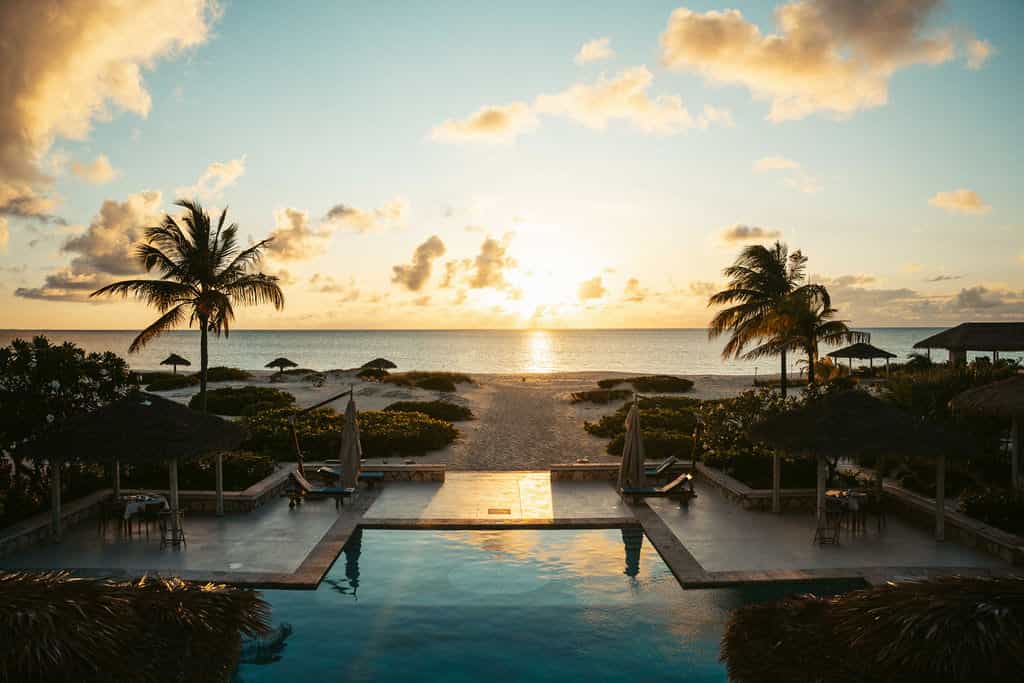 a pool overlooking the ocean at dusk