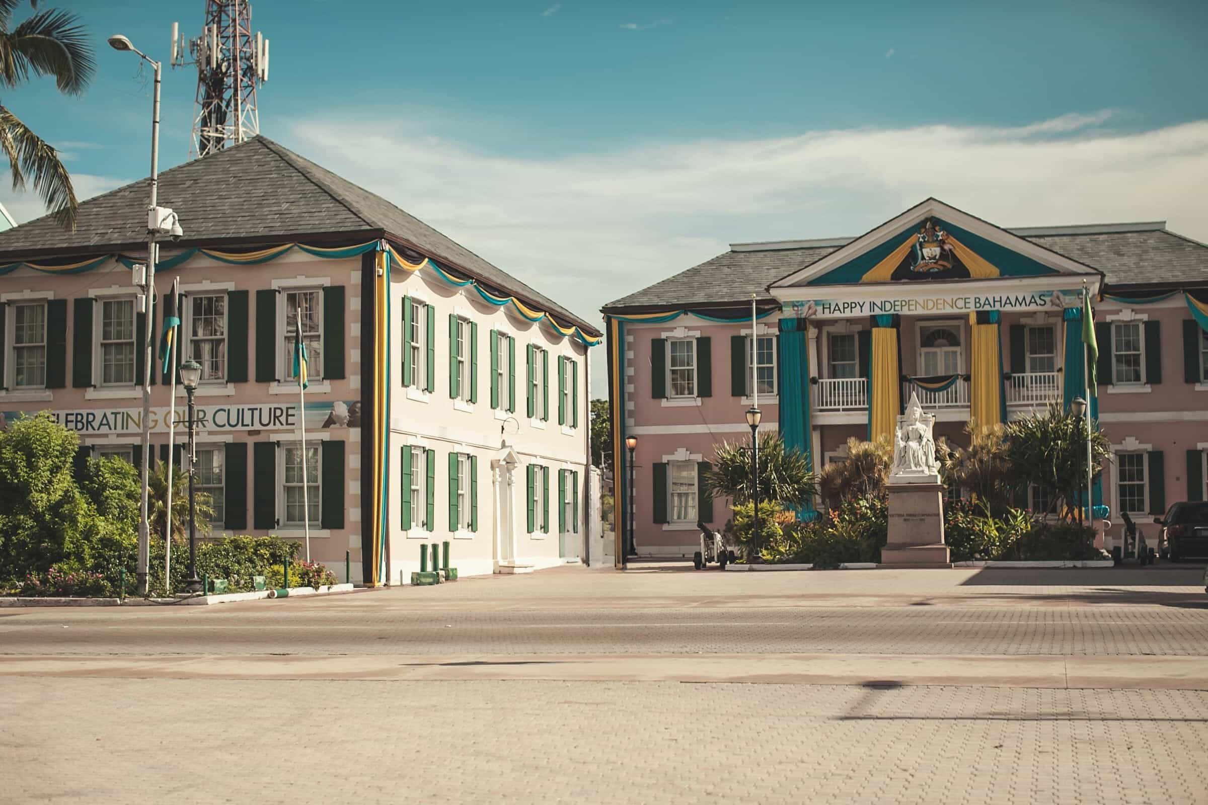 Brick roads with two colonial government buildings during daytime