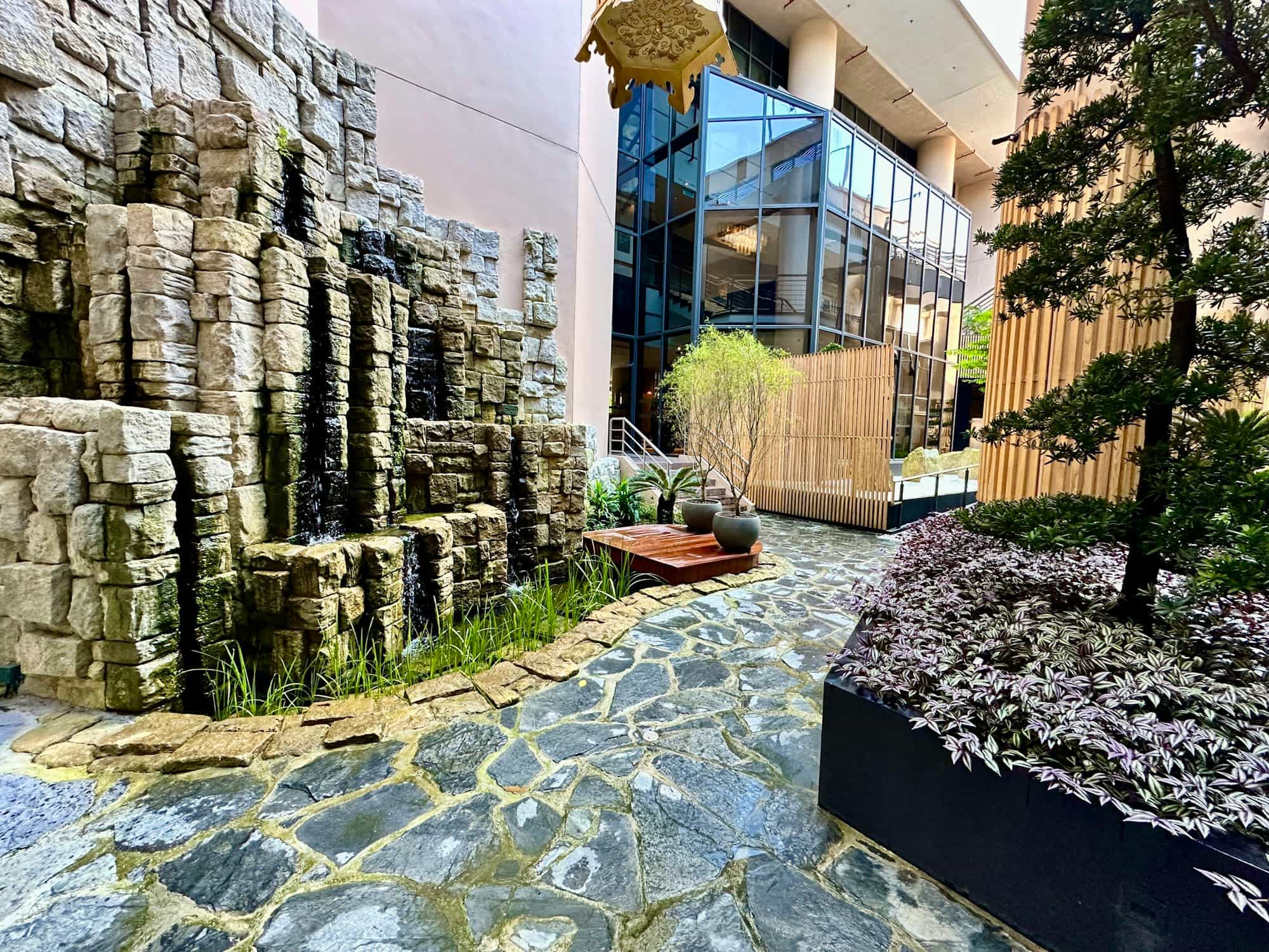a secret urban garden terrace with stone flooring