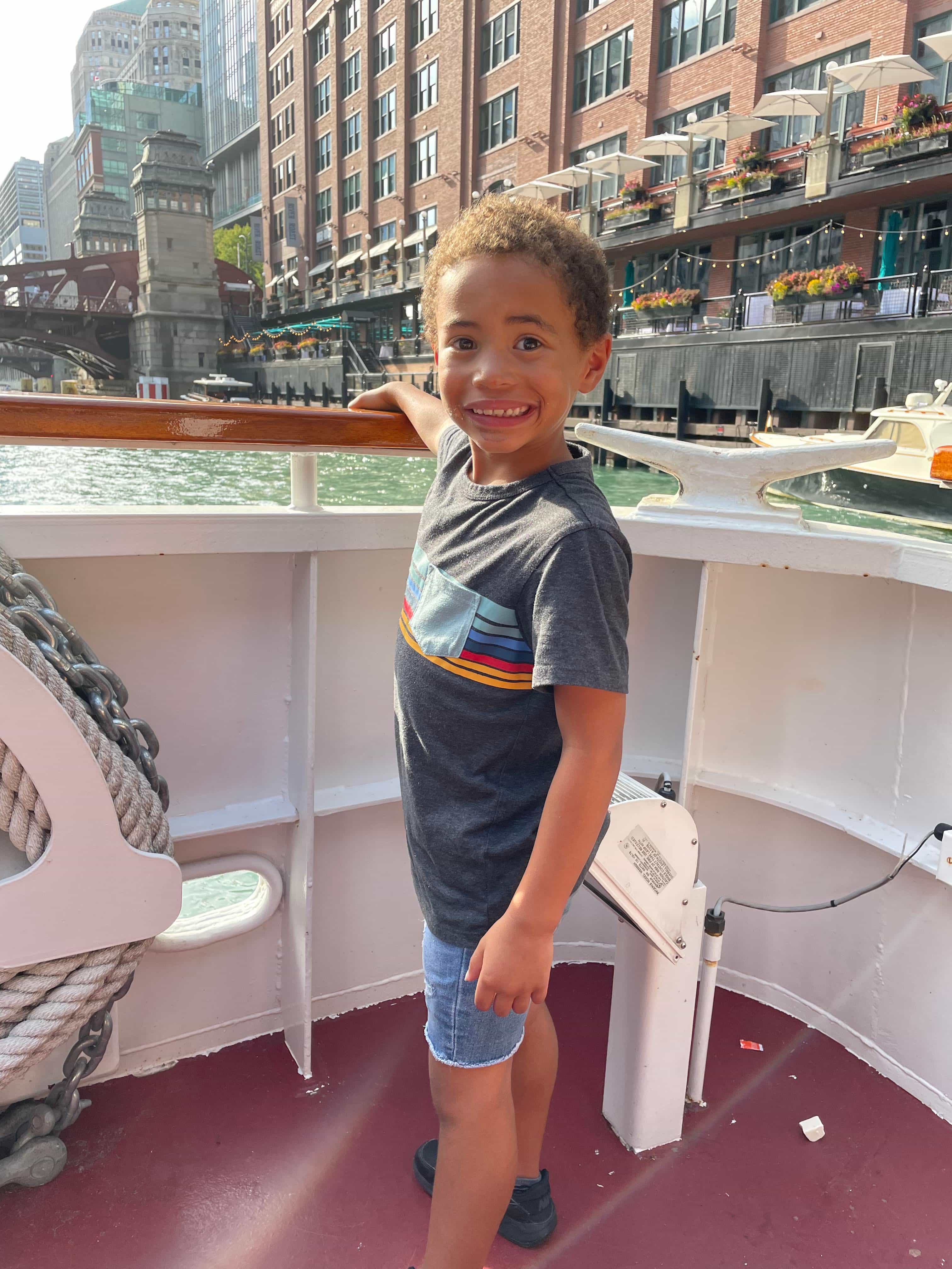 A image of the Advisors child on a boat ride during the day.