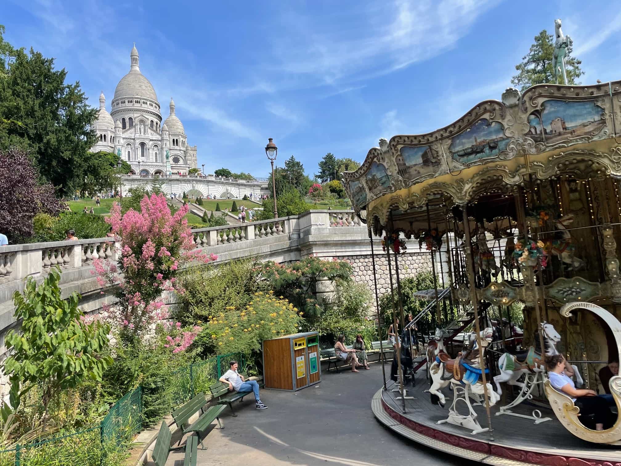 View of an old-fashioned carousel in a park on a sunny day