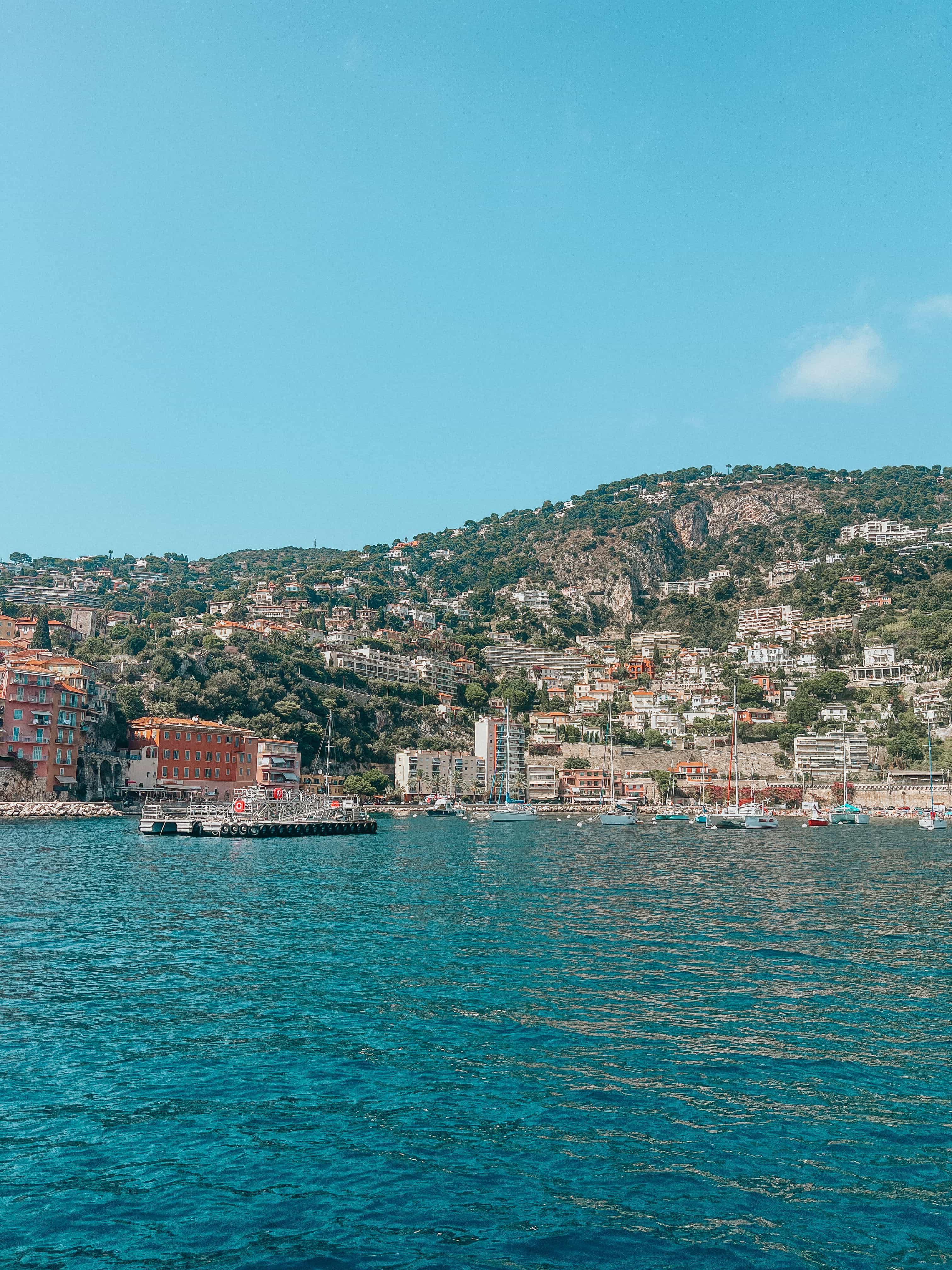 View of a coastal city seen from the sea on a sunny day