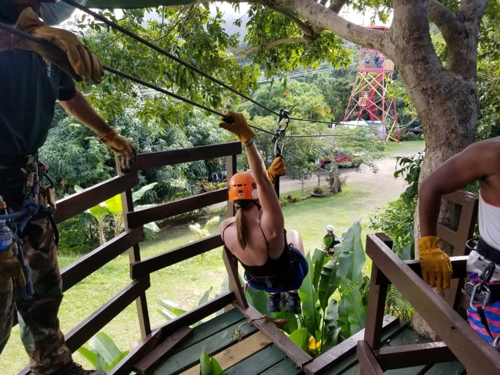 Advisor on a zipline through the jungle