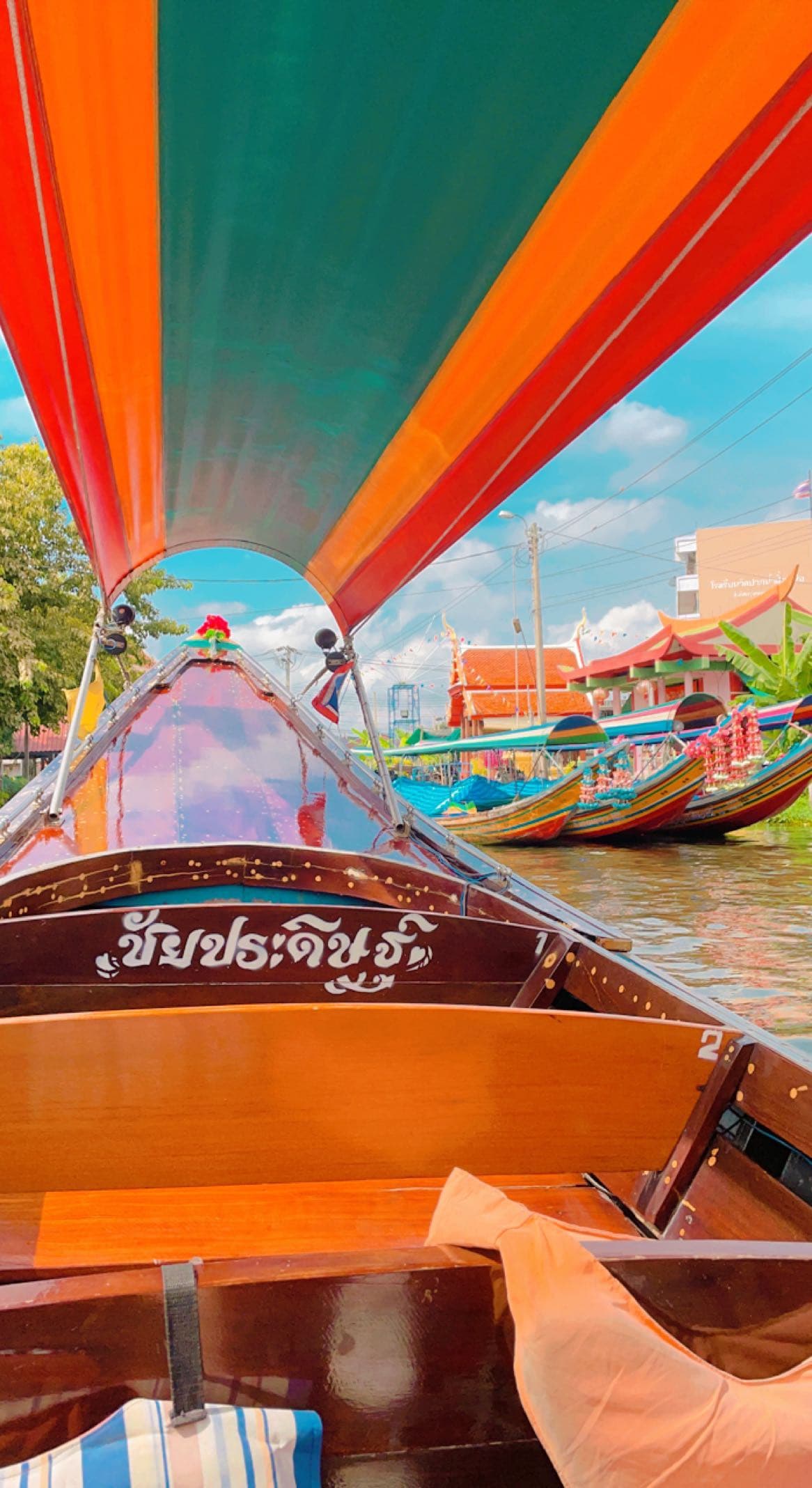 Colorful sailboat cruising on the water during the daytime.