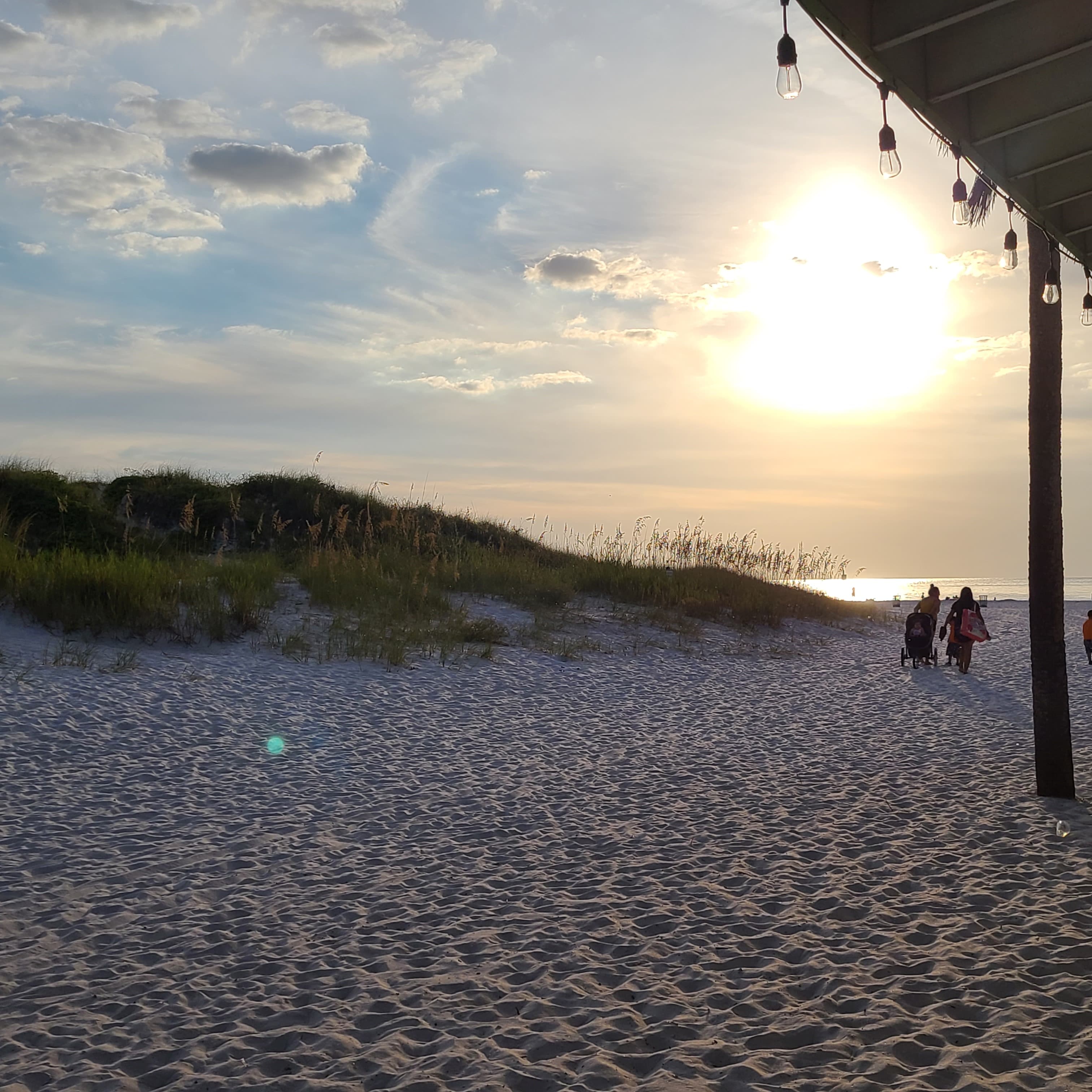 A view of the beach at dusk. 