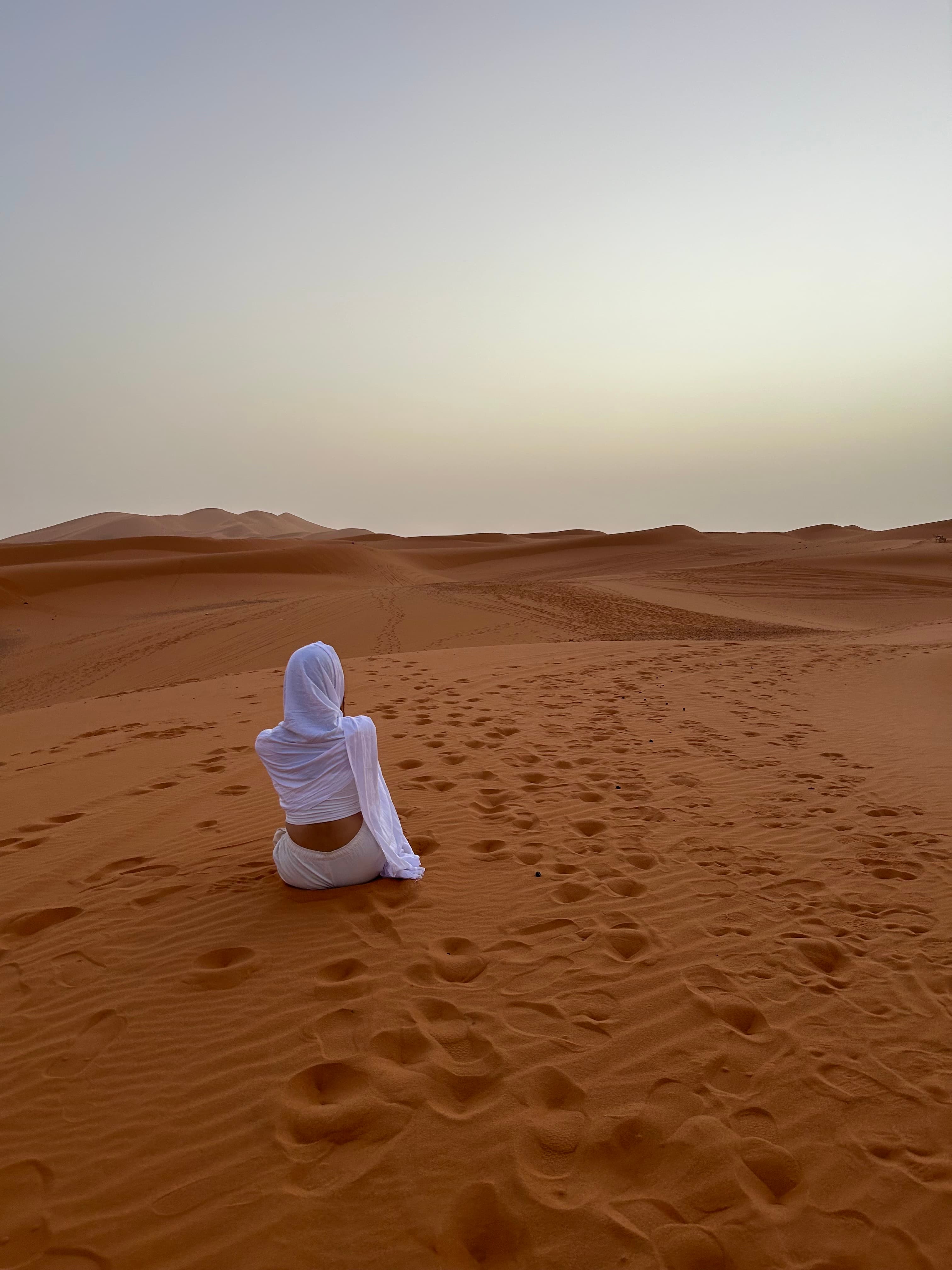 Sitting on the sand dunes.