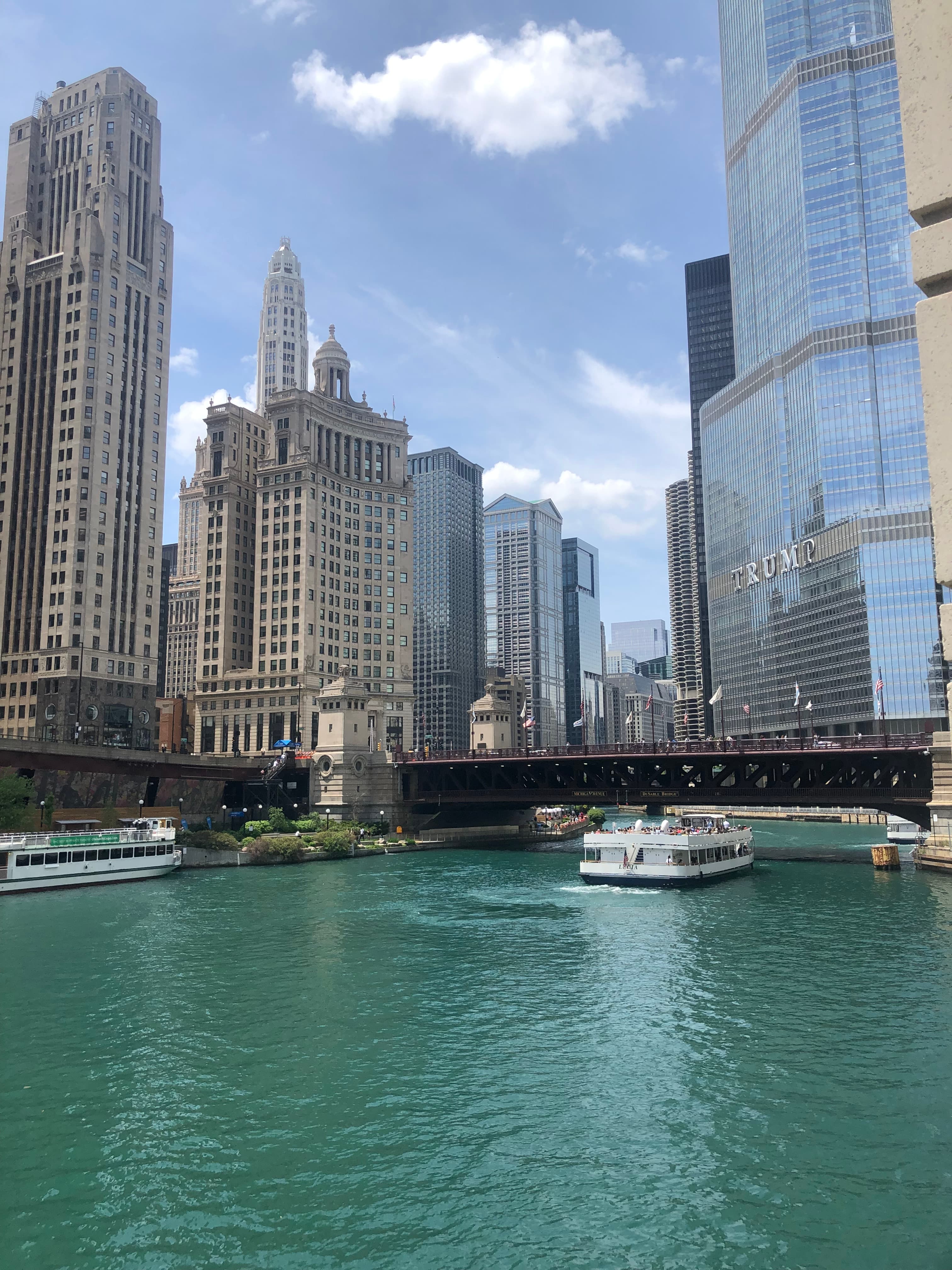 Tall buildings surrounded by water during the daytime.
