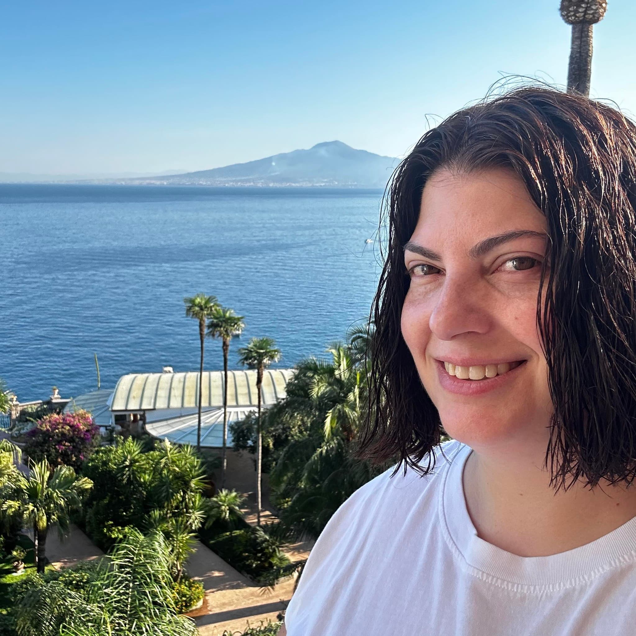Selfie of advisor with a beautiful ocean view behind her