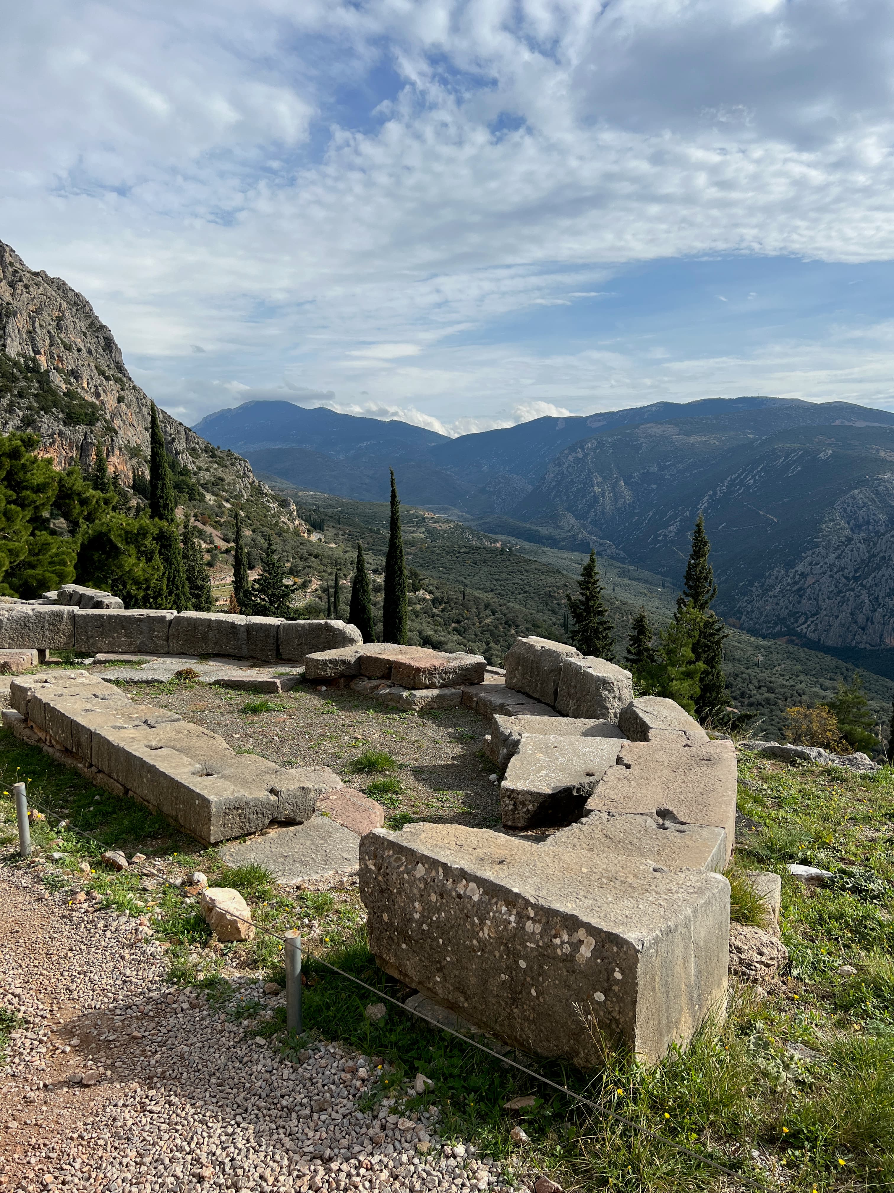 A view of a lookout point during the day with nature in the distance.