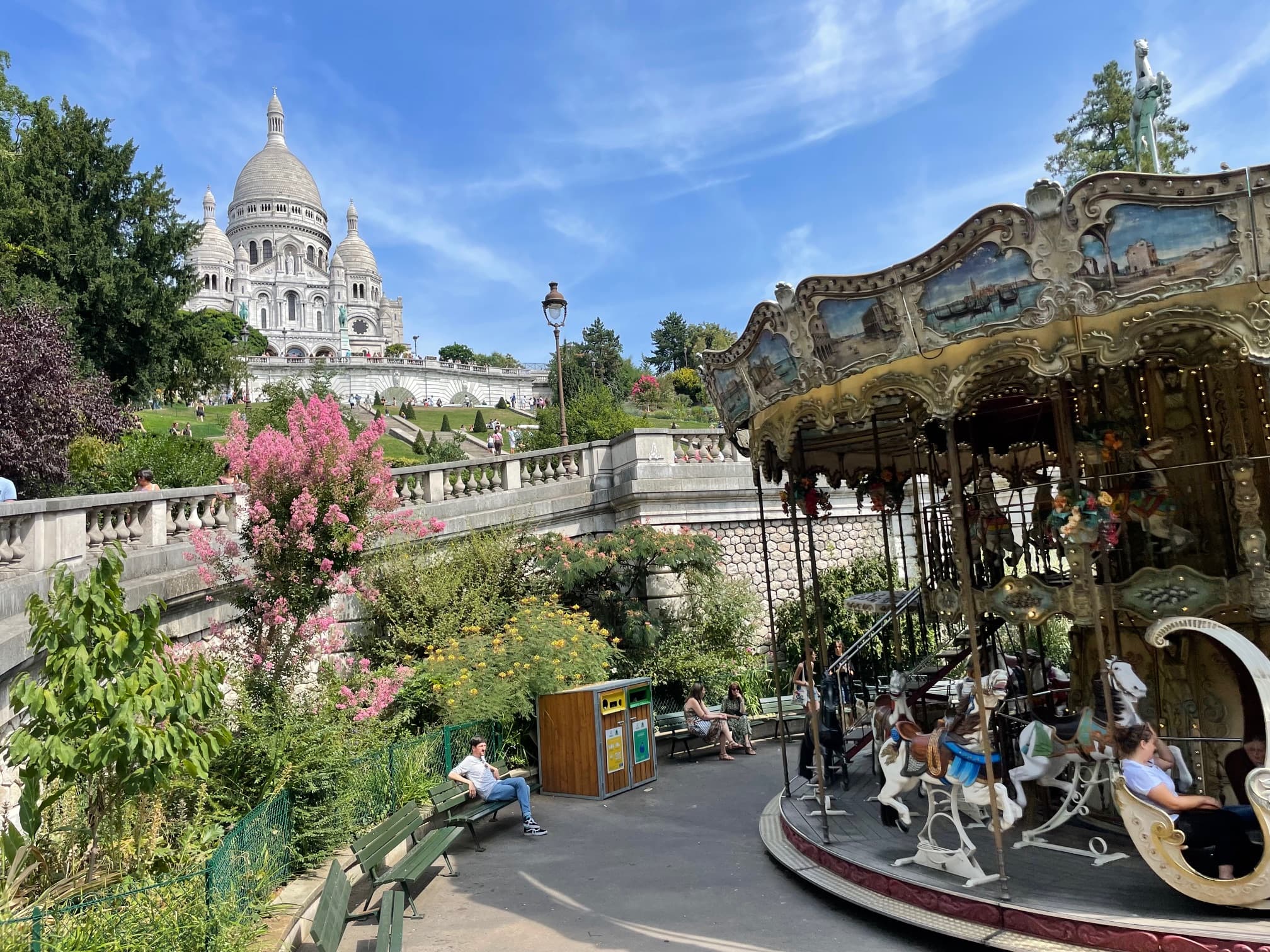 View of an old-fashioned carousel in a park on a sunny day