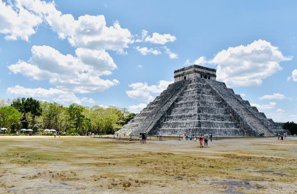 A pyramid in the middle of a field