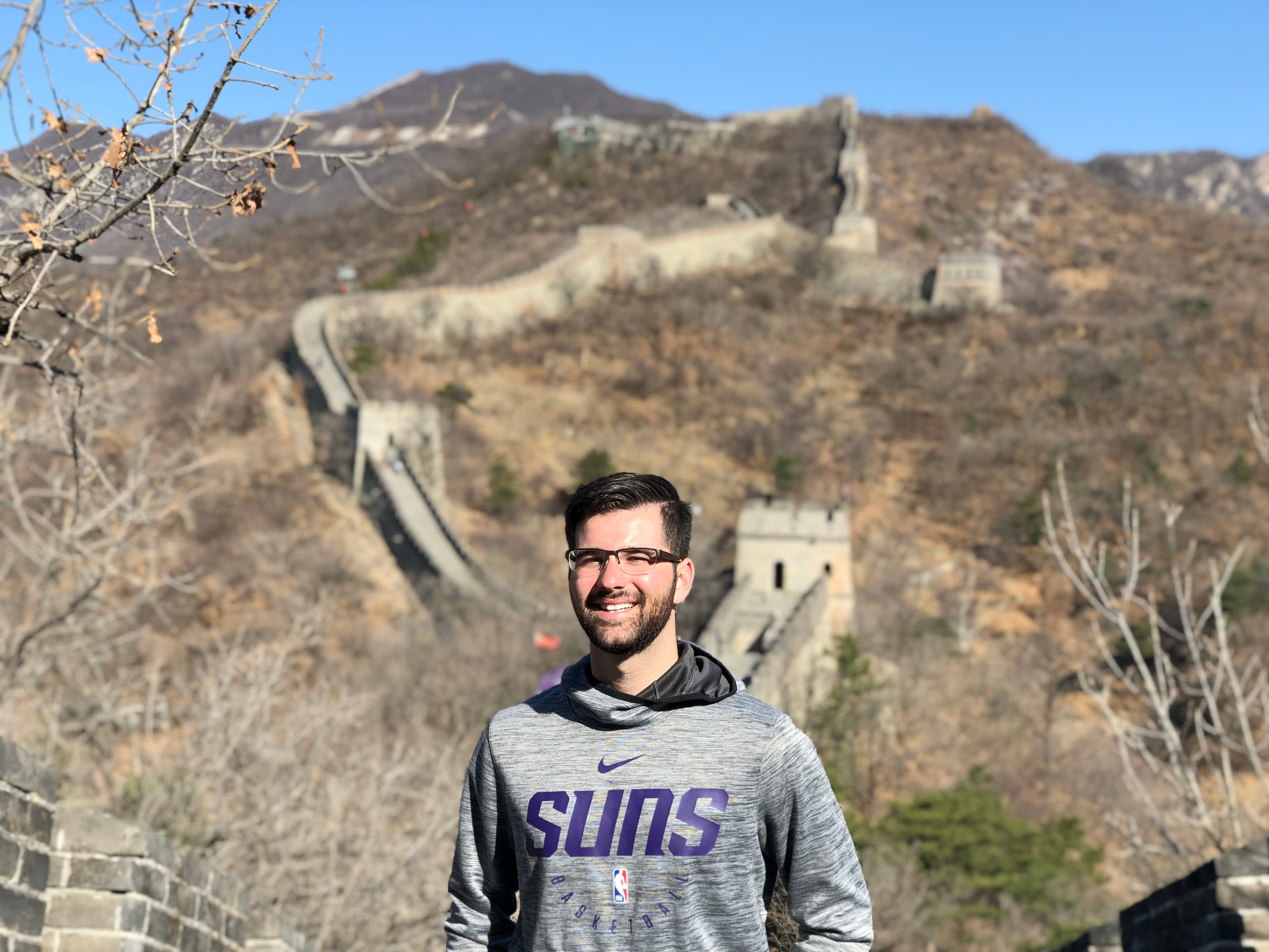 Advisor on the Great Wall of China in a Phoenix Suns sweatshirt 