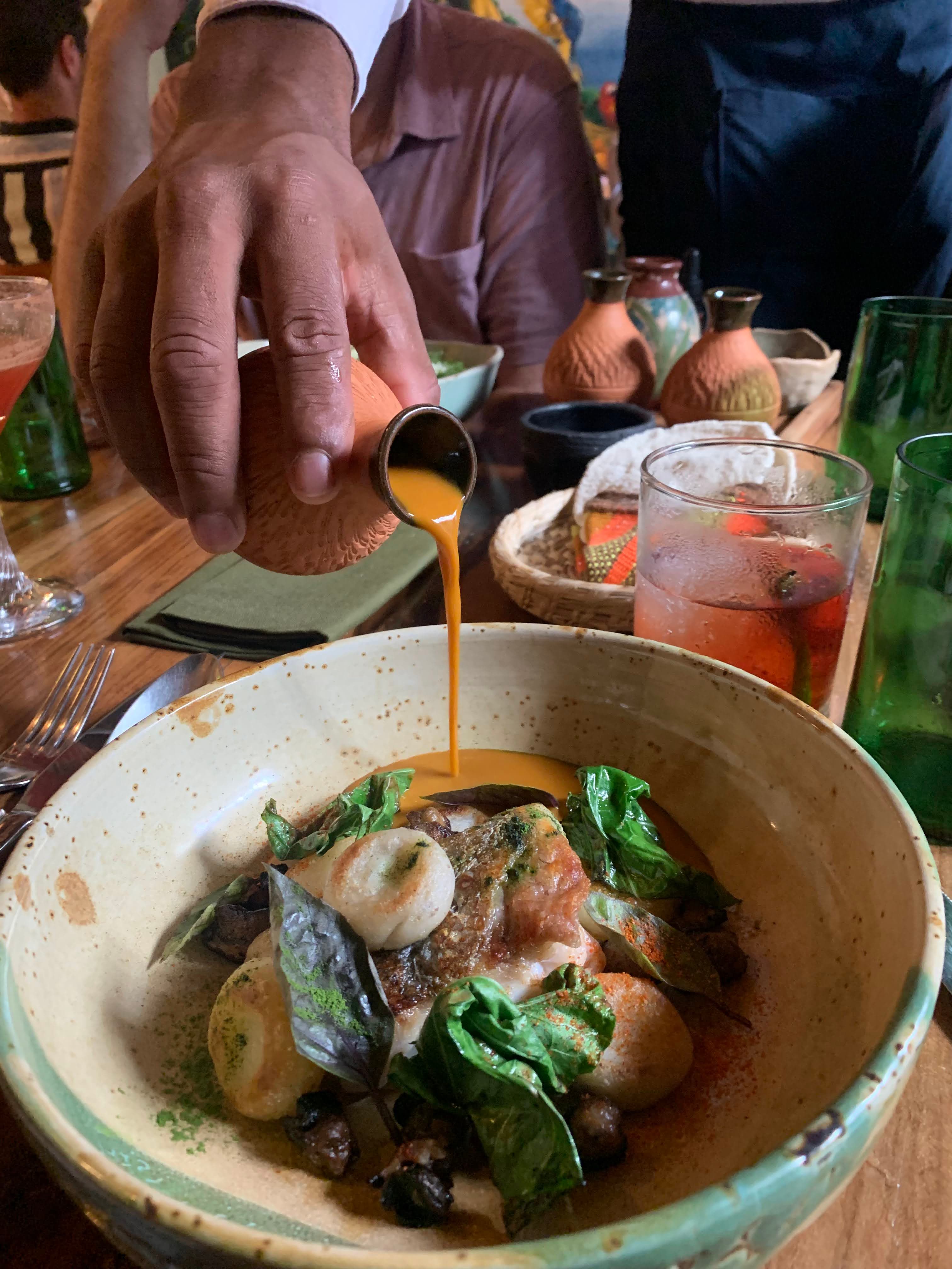 A delicious bowl of food with sauce. 