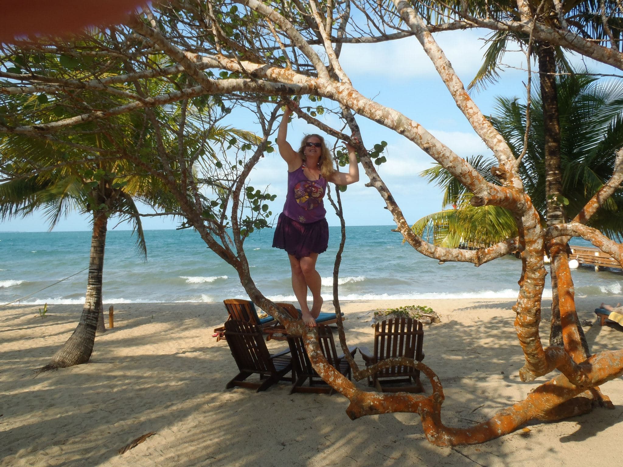 Shanna Payner posing under trees