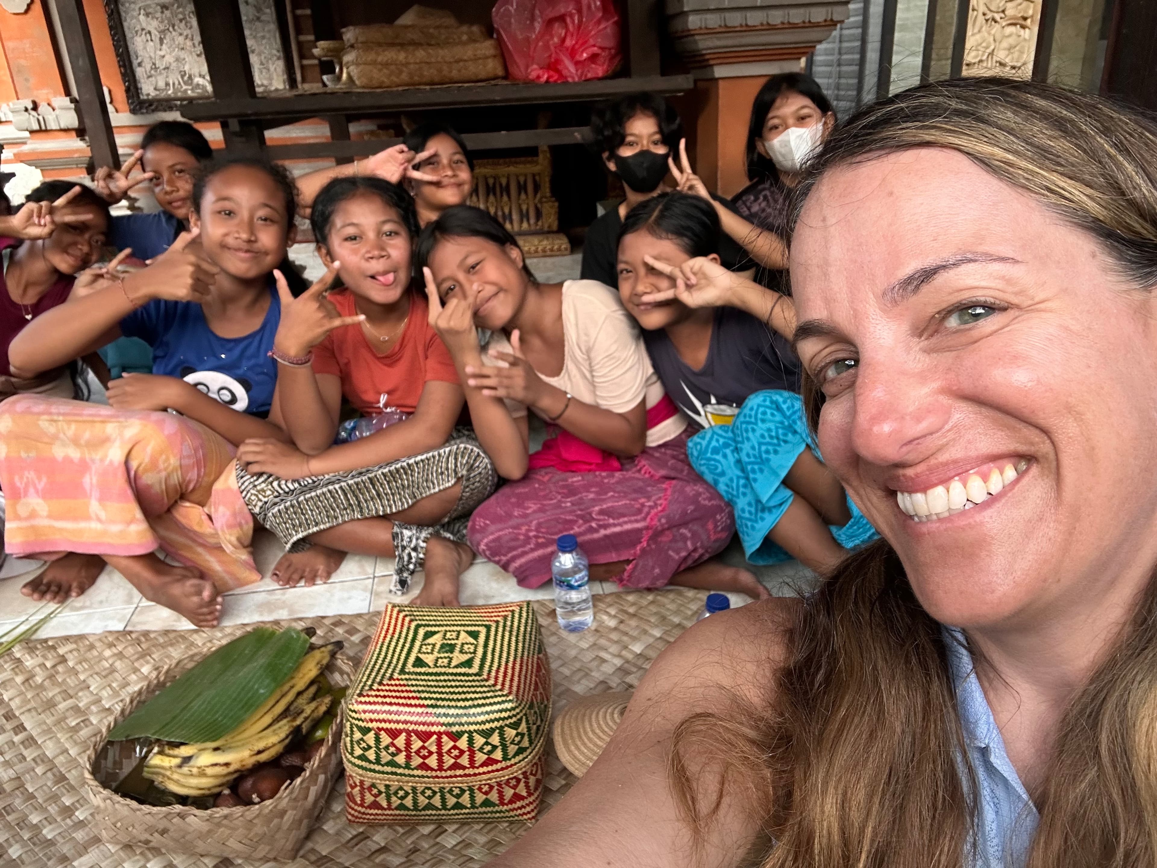 Travel advisor posing with a group of kids