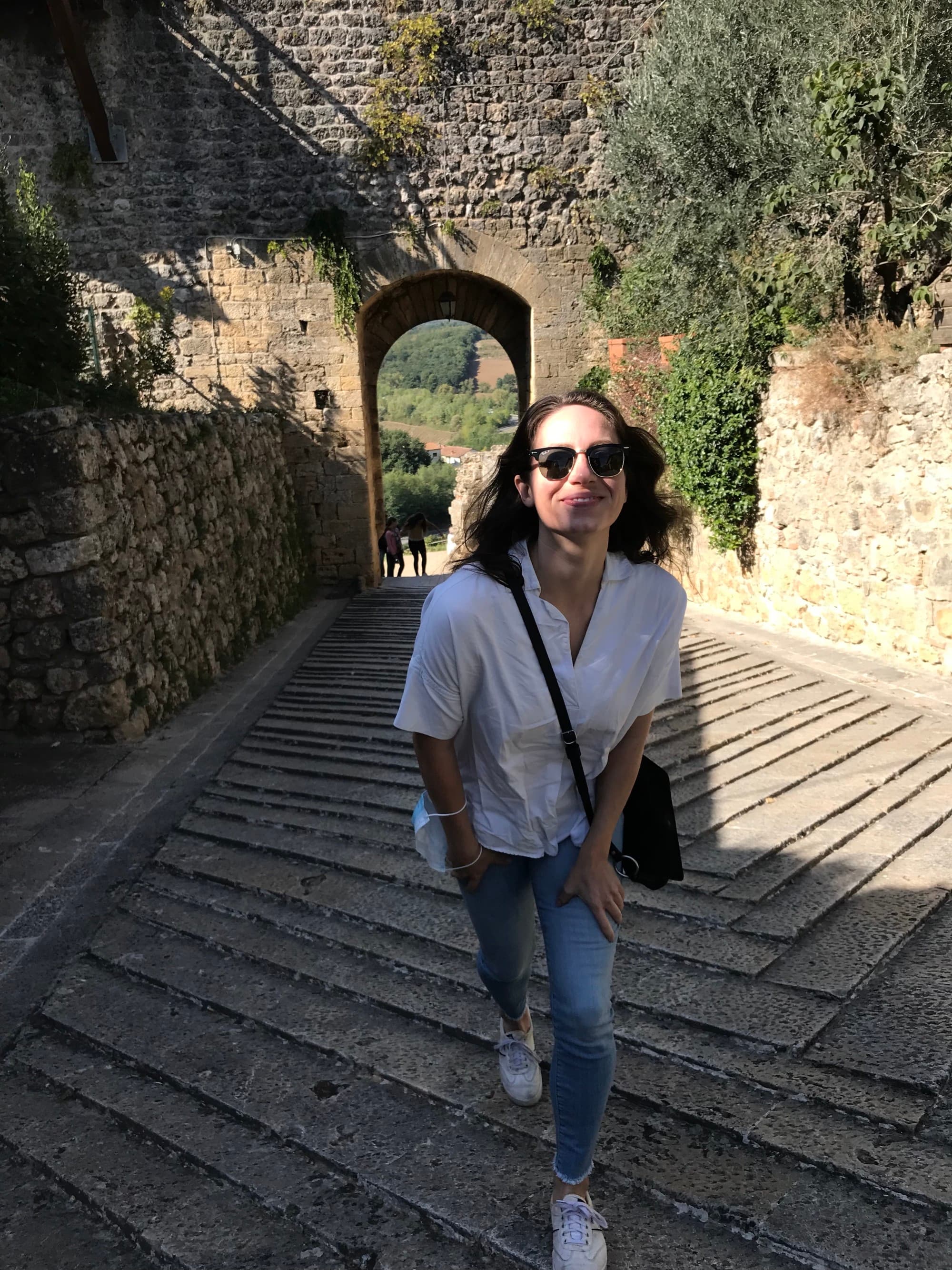 travel advisor Misha Sharp walks up a long ancient staircase