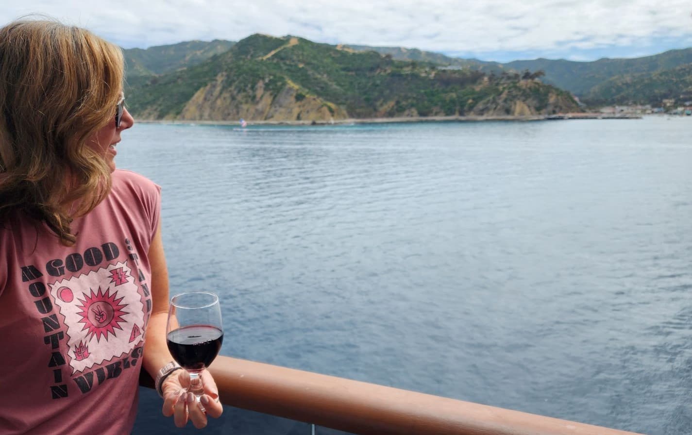 Travel advisor posing beside sea