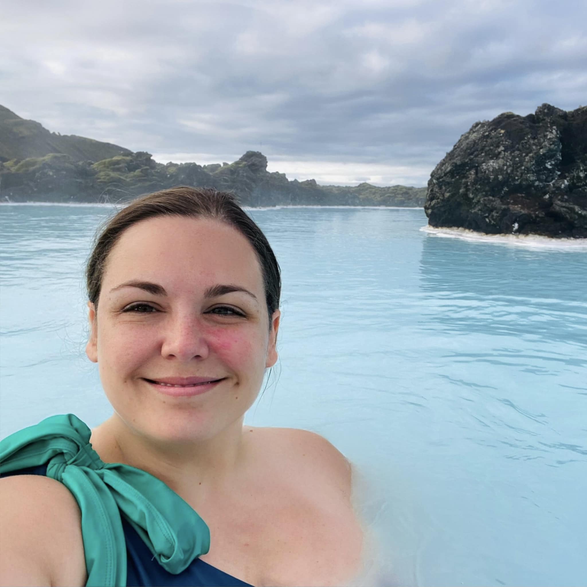 Travel advisor posing in a sea water