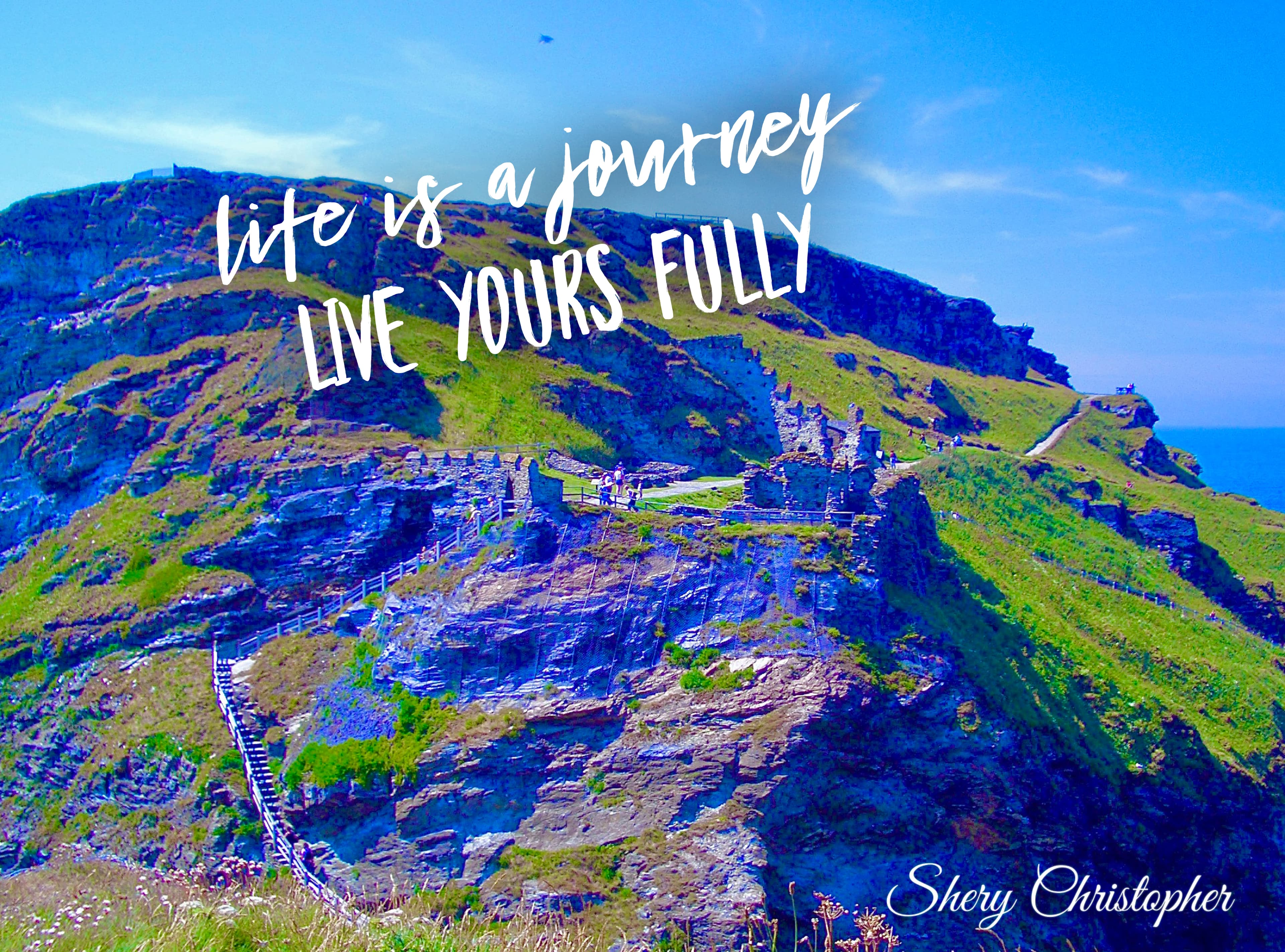 A beautiful view of nature with white text that reads "Life is a journey LIVE YOURS FULLY"