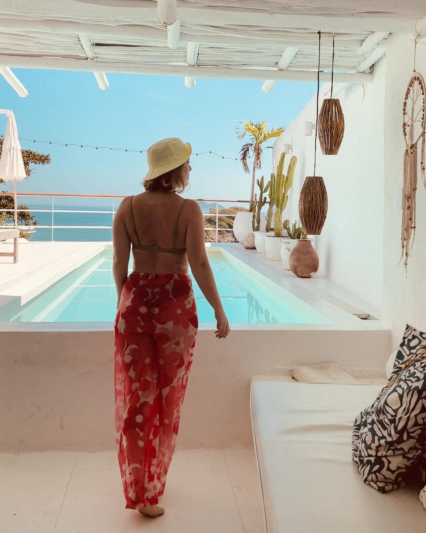 Travel advisor posing on a poolside