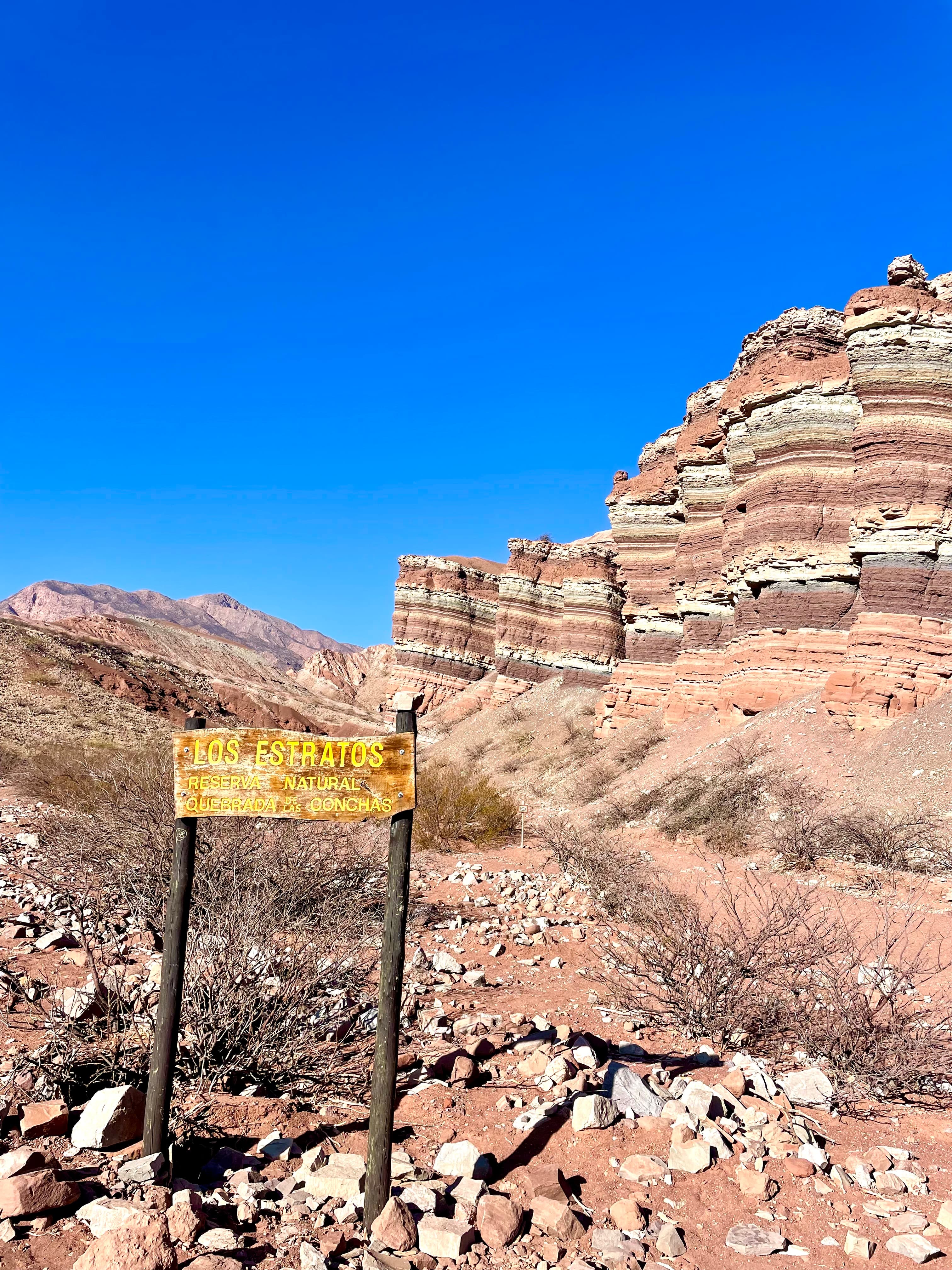 Sandy rocks under blue sky