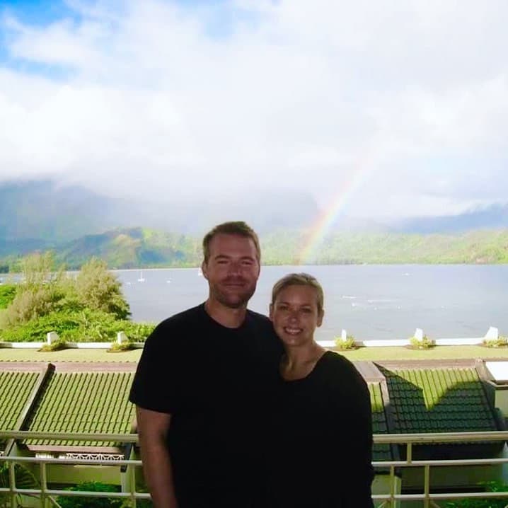 couple posing on a lakeside