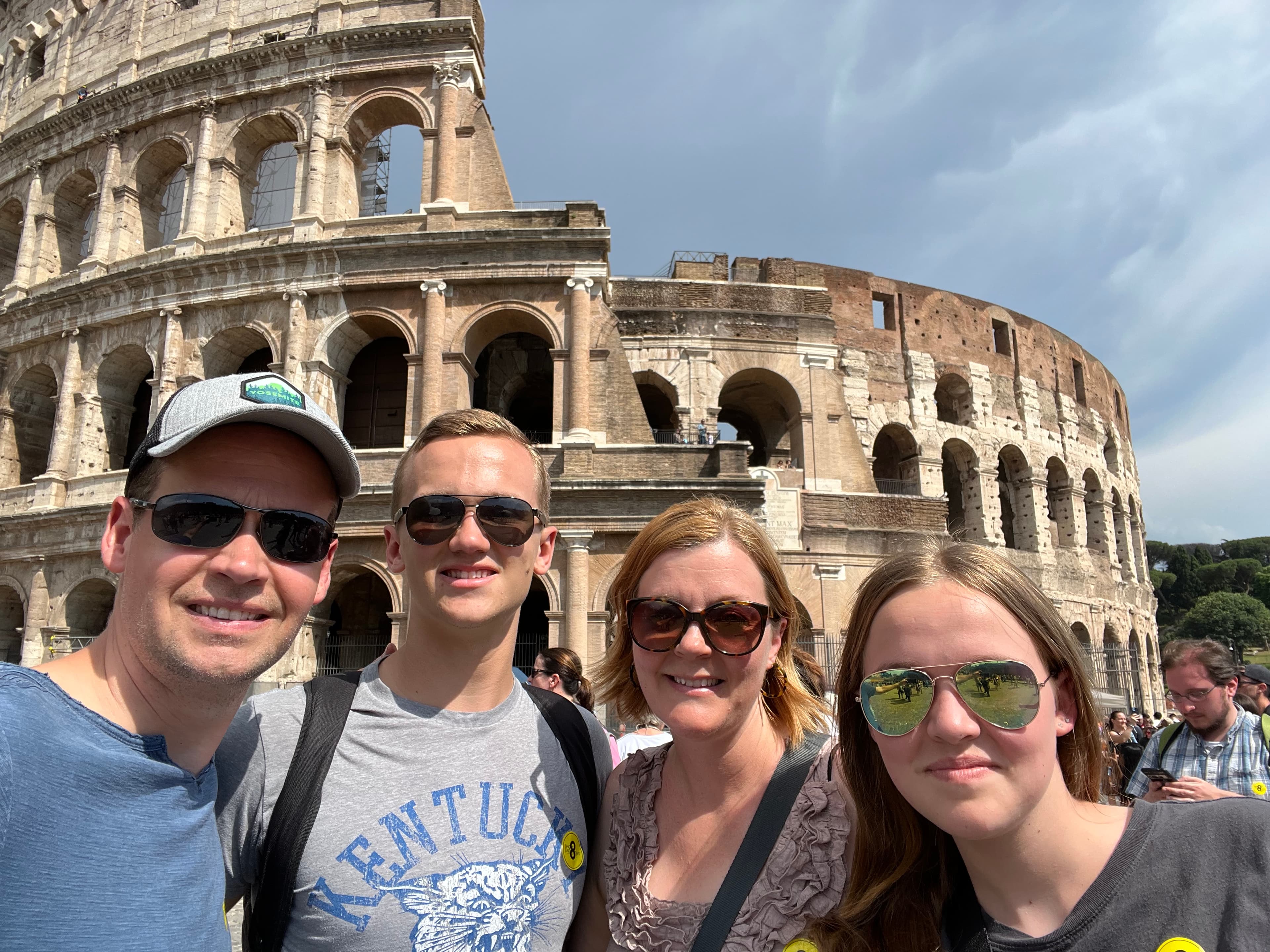 People posing with colosseum