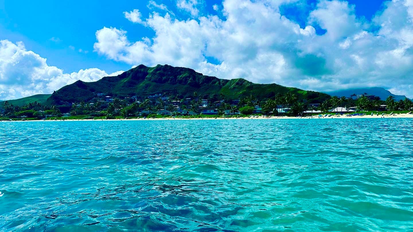lush green mountainous island view from the ocean