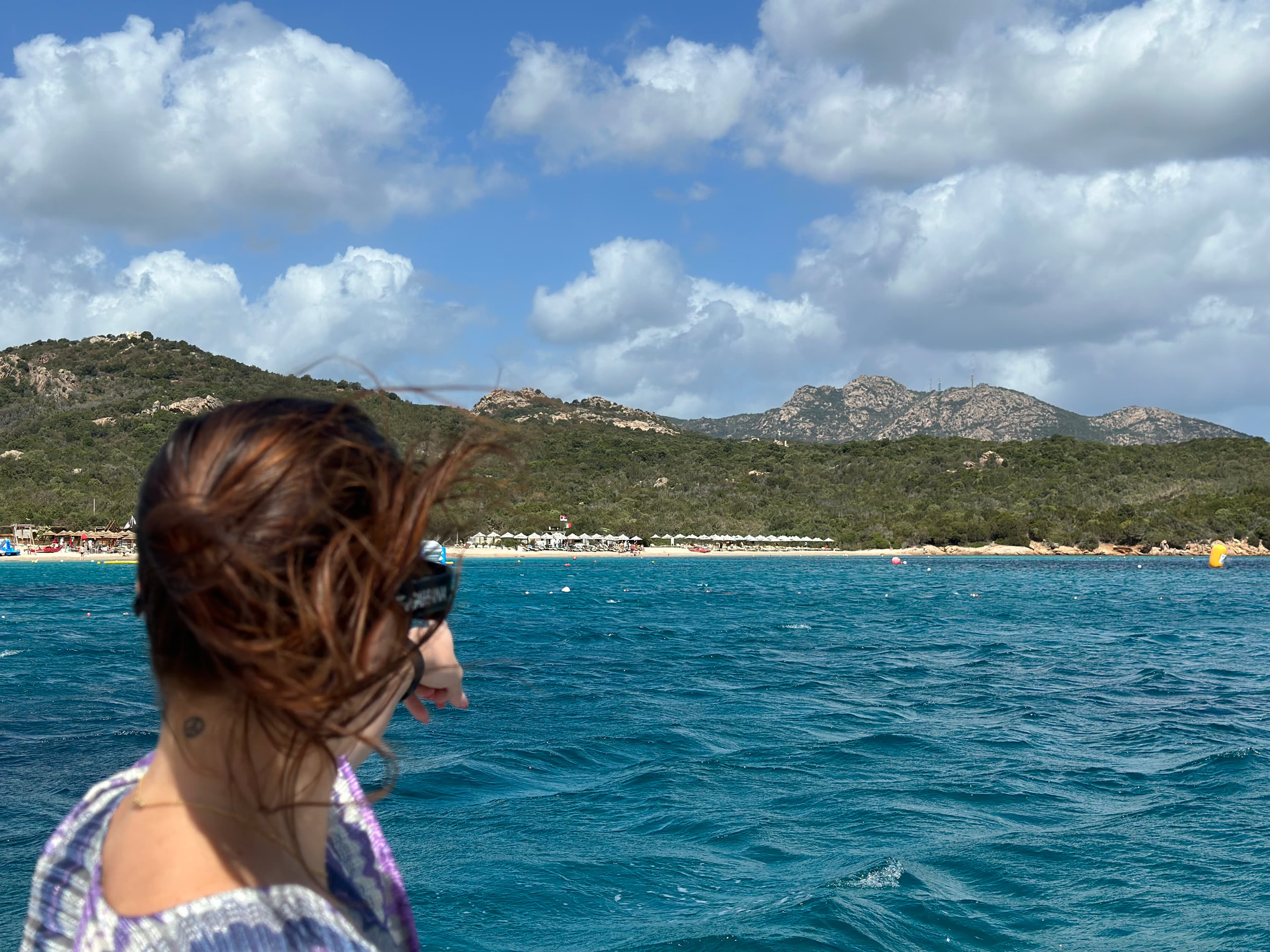 Travel advisor posing at a lake side