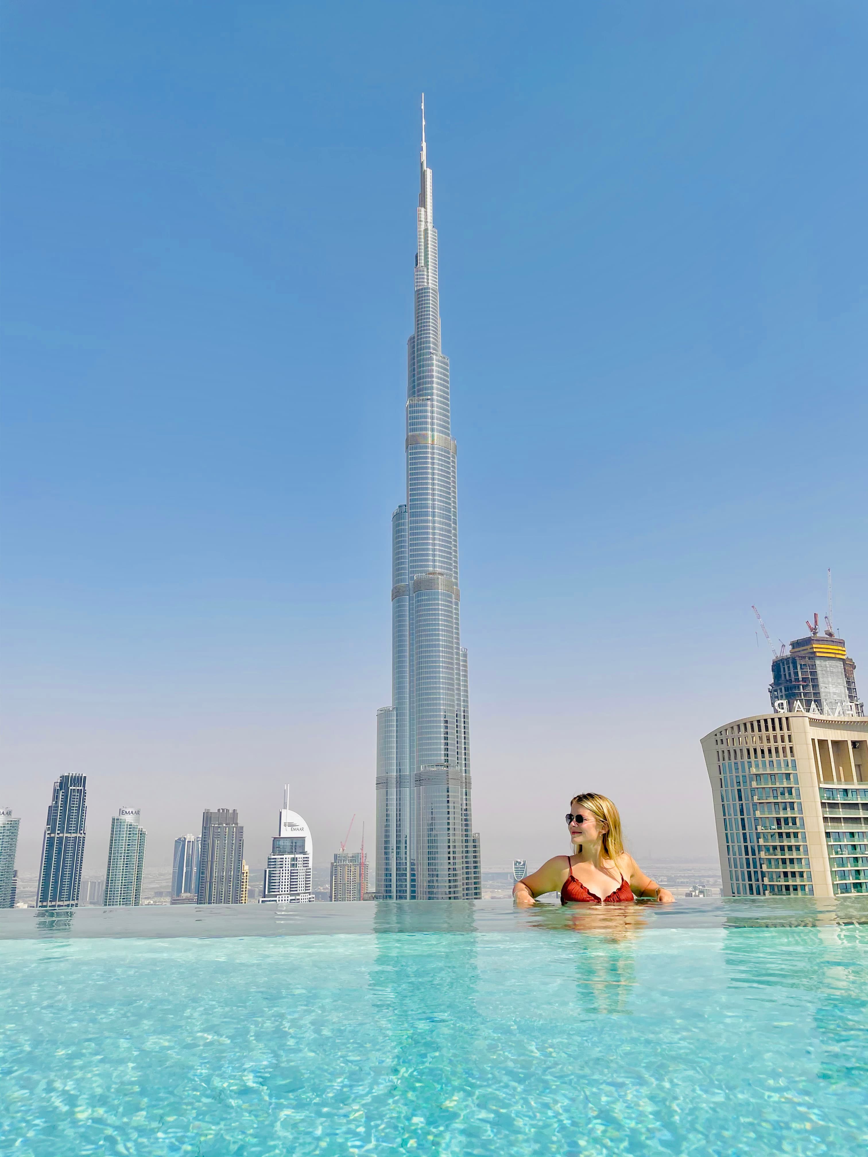 Picture of Kelsey in pool with a view of Burj Khalifa