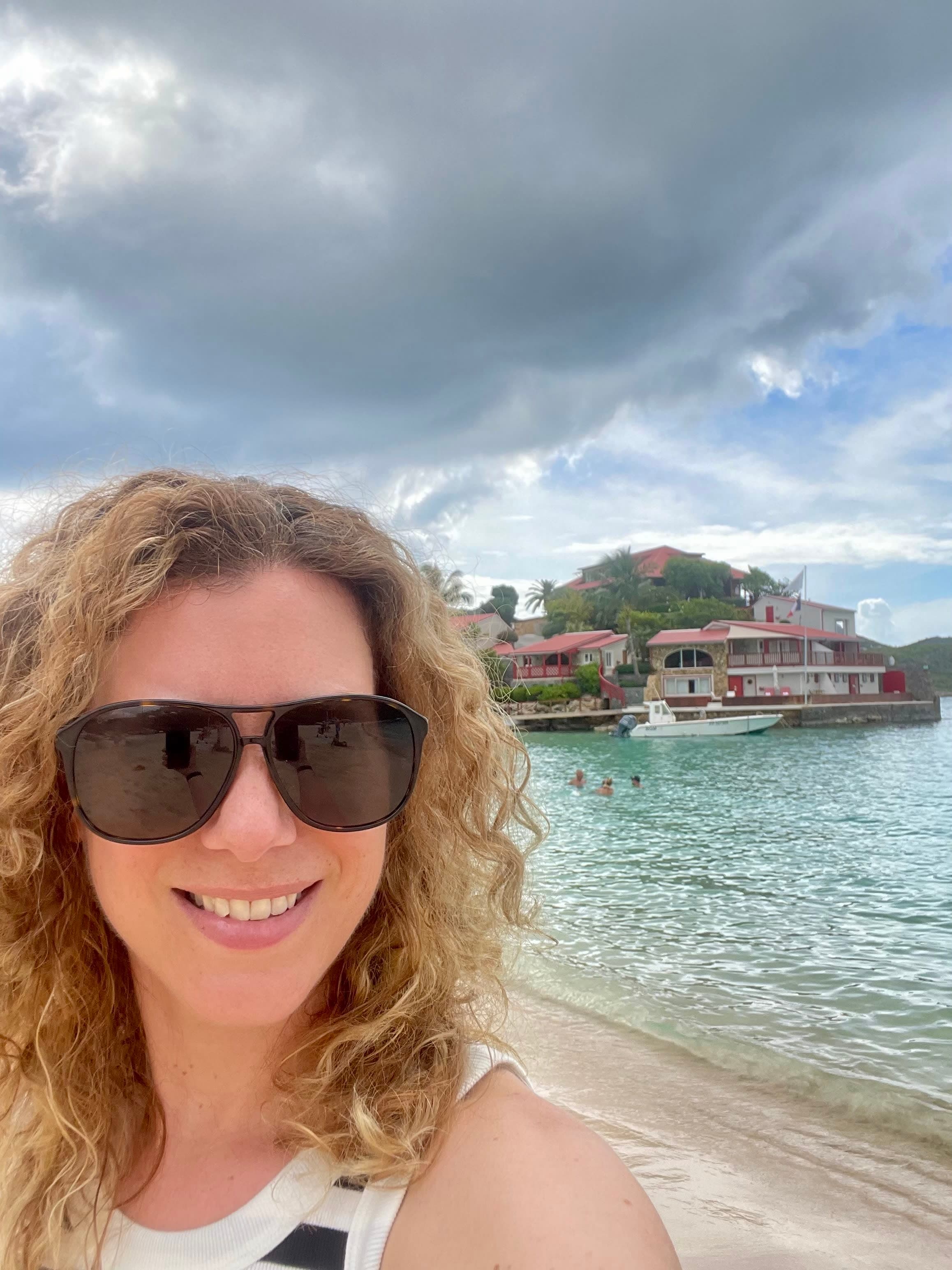 Travel advisor Alexandra taking a selfie on a beach
