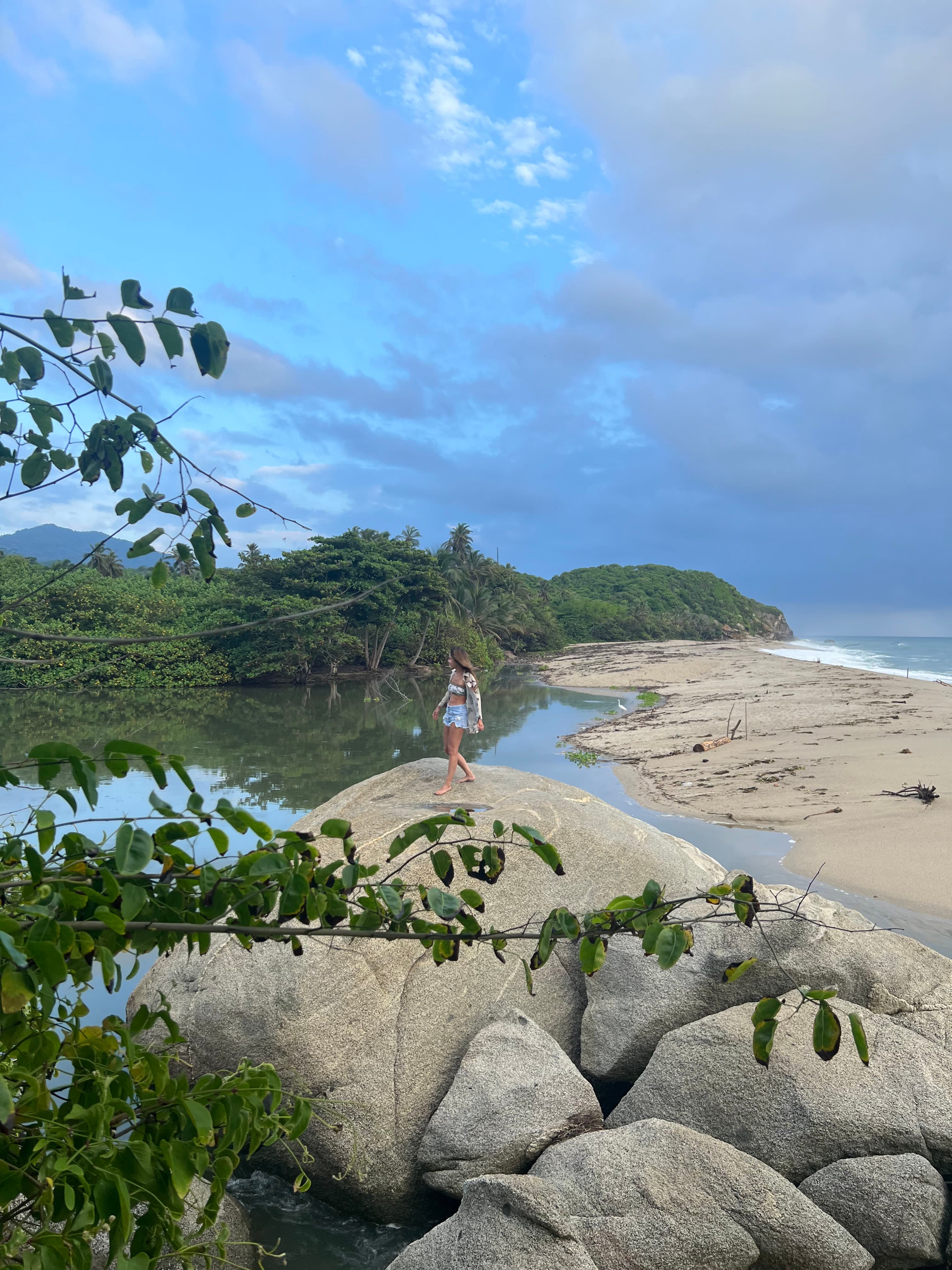 Picture of Andrea standing on stone