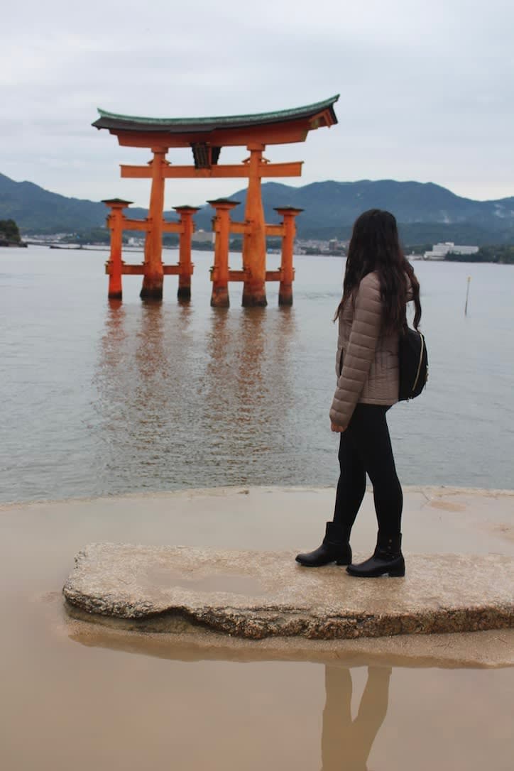 Aashima facing away and looking at the Itsukushima Jinja shrine