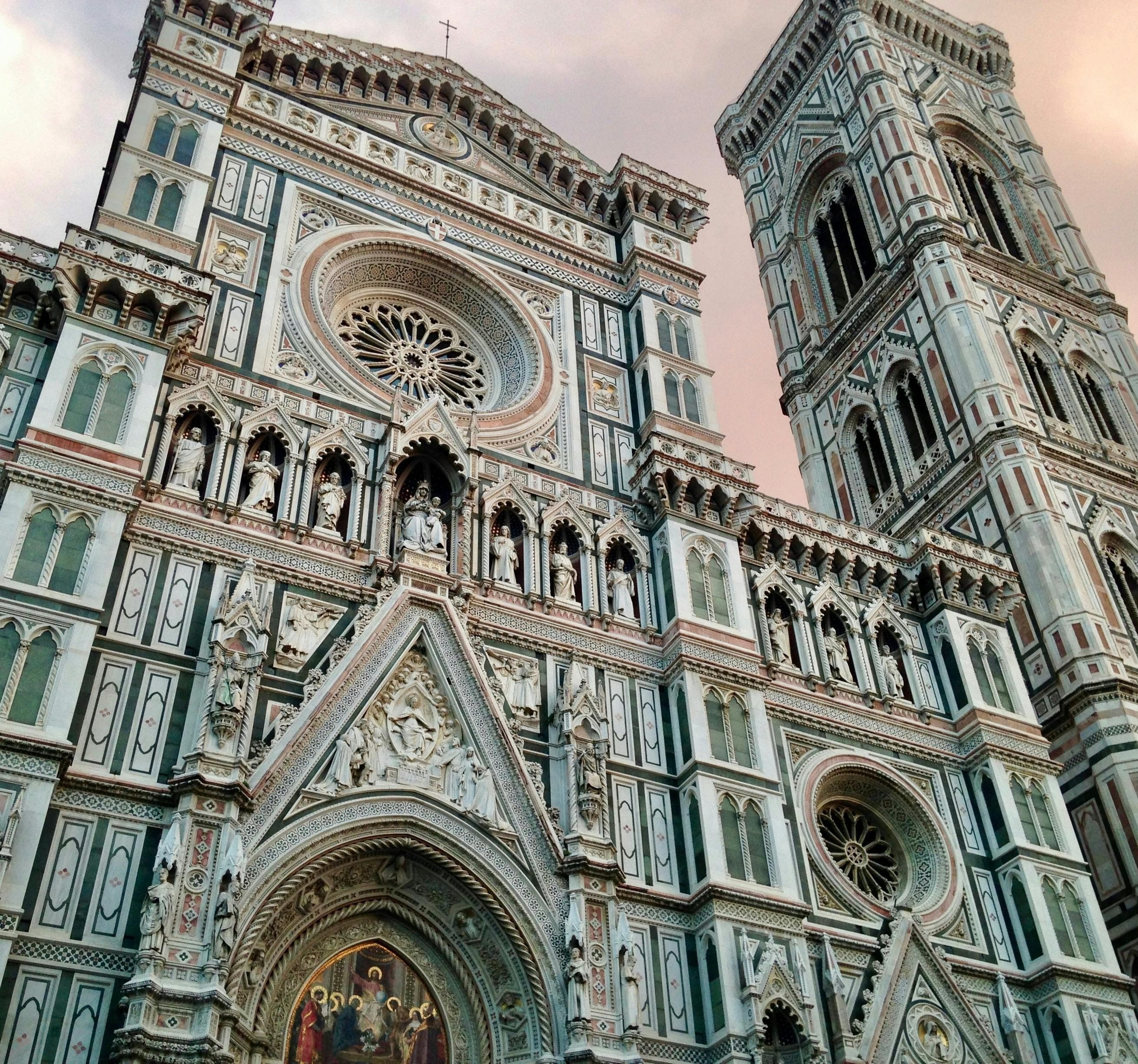 A low-angled view of a large, gothic-style cathedral during the daytime