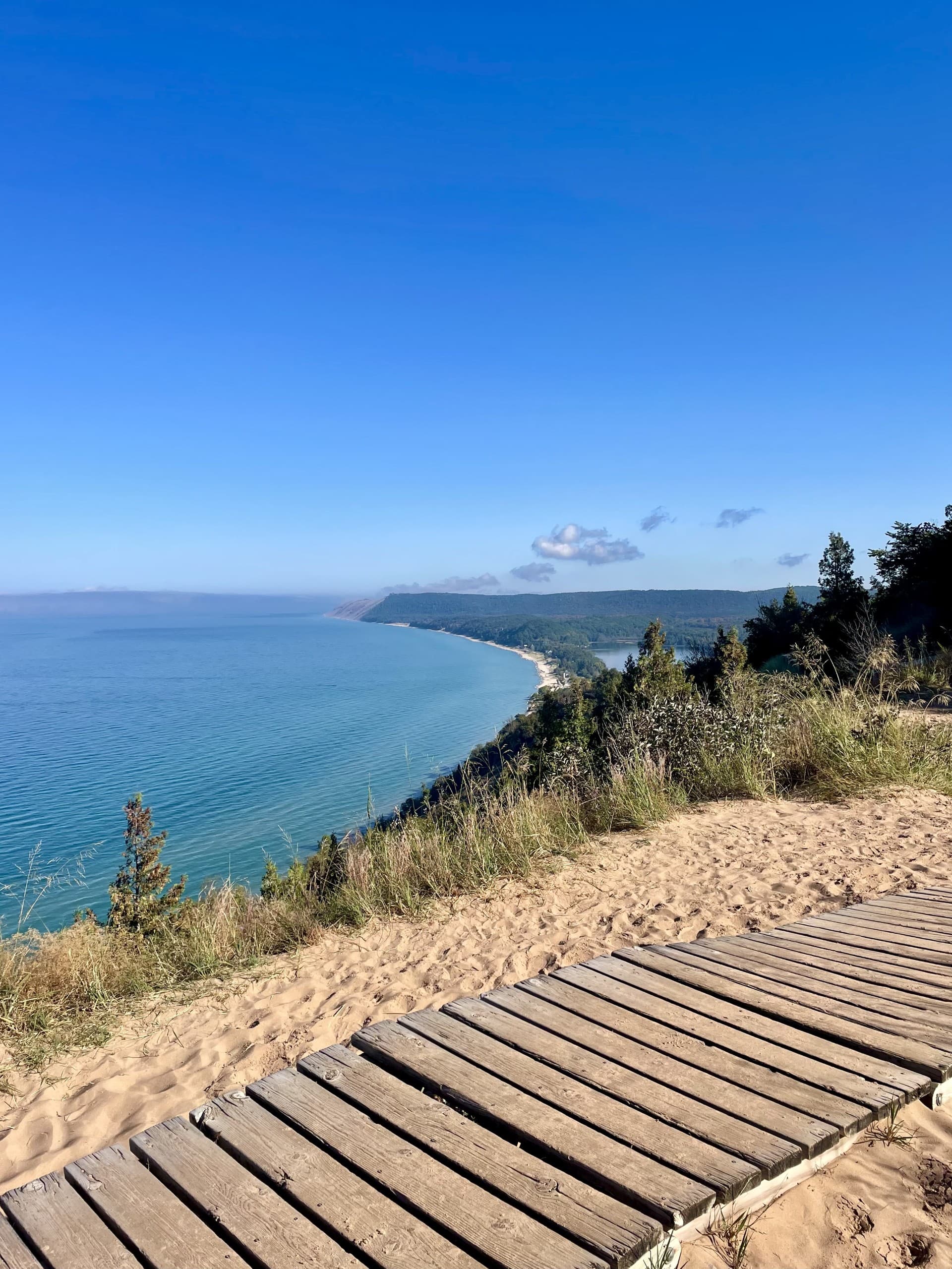 All walking trail along a water coast line during the daytime