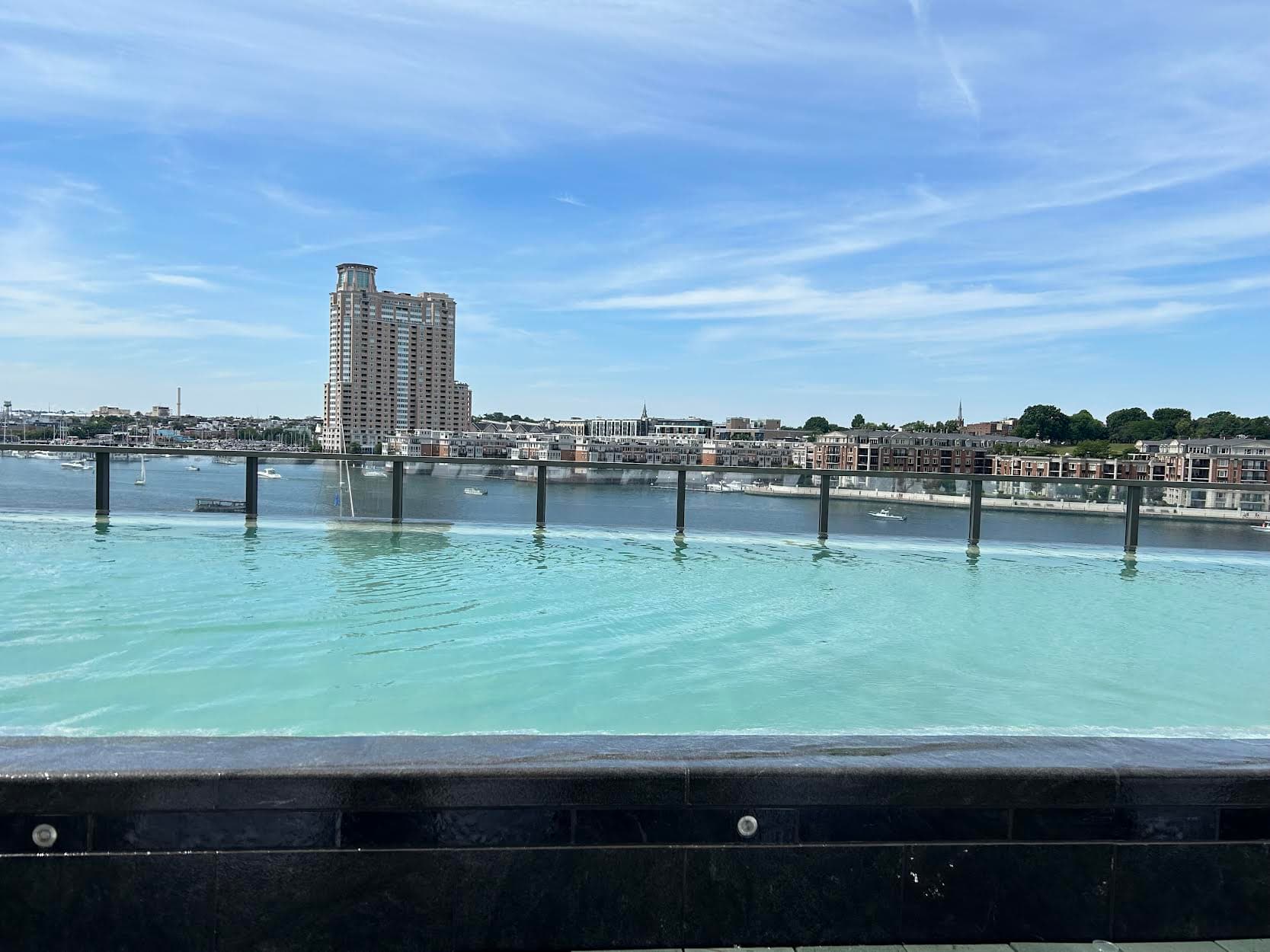 Skyscrapers reach for the sky on a bustling downtown block on a cloudy day.