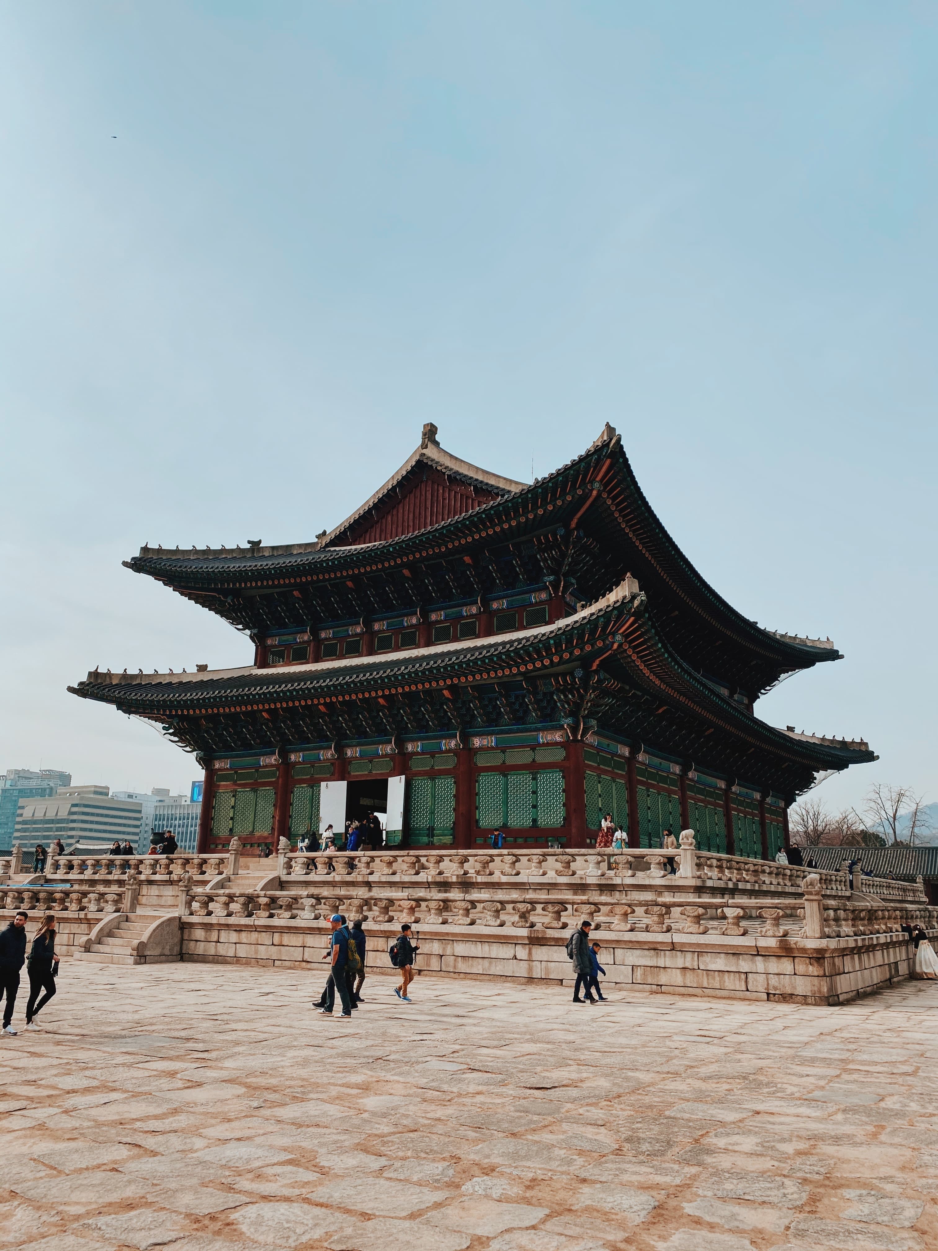 people standing in front of large palace during daytime