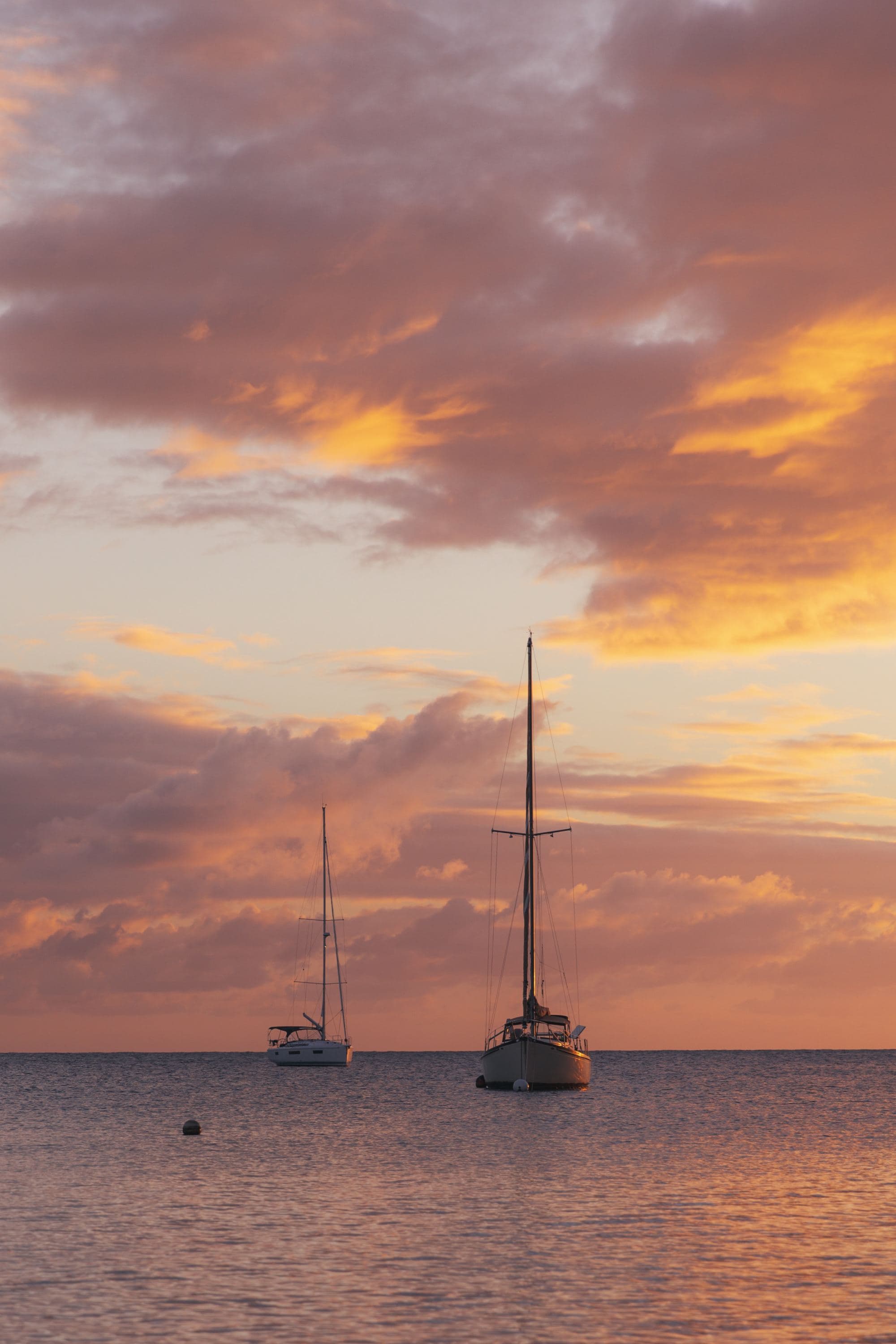 A couple of boats on a body of water.