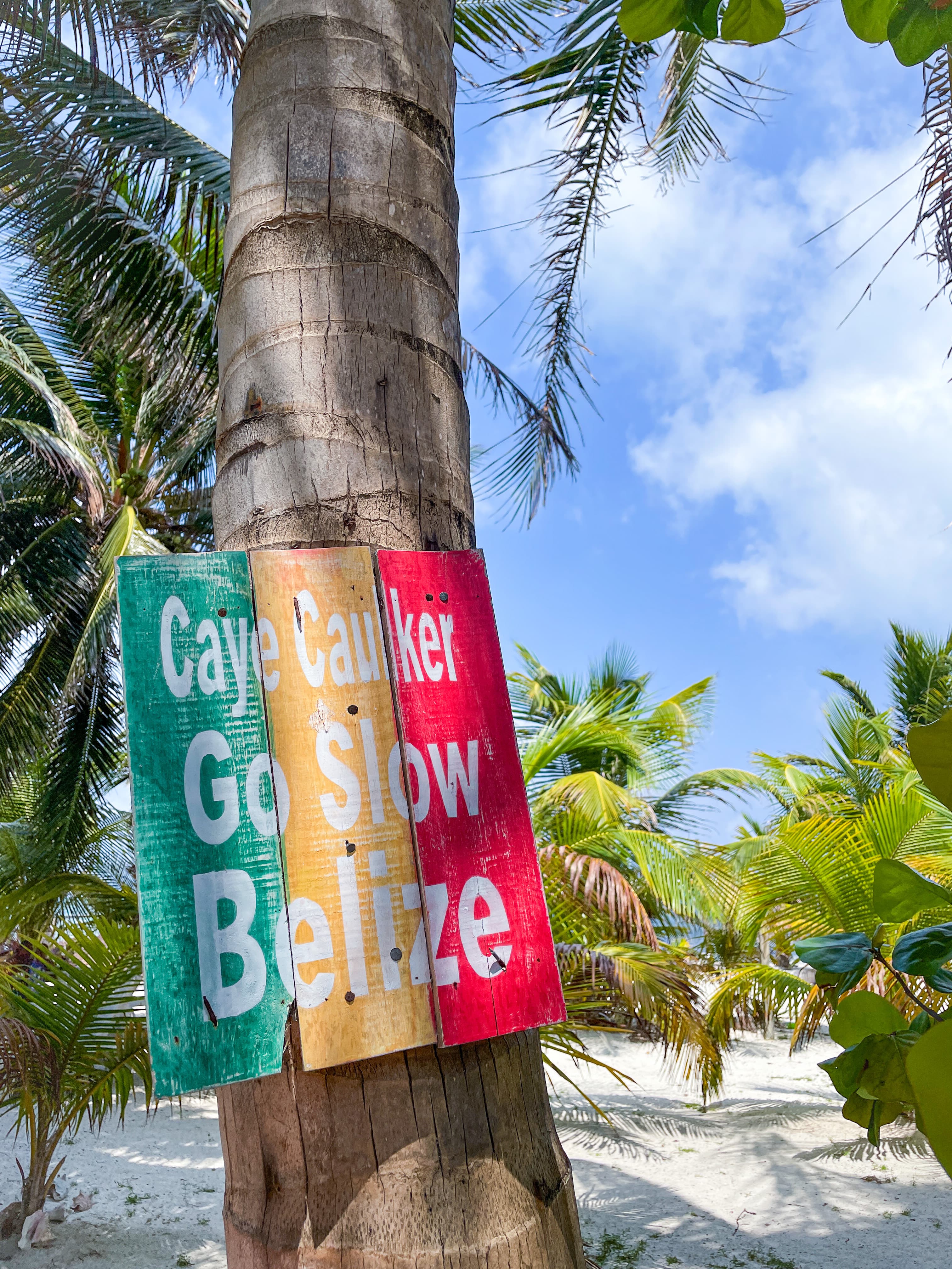 A written, colorful sign in Belize.
