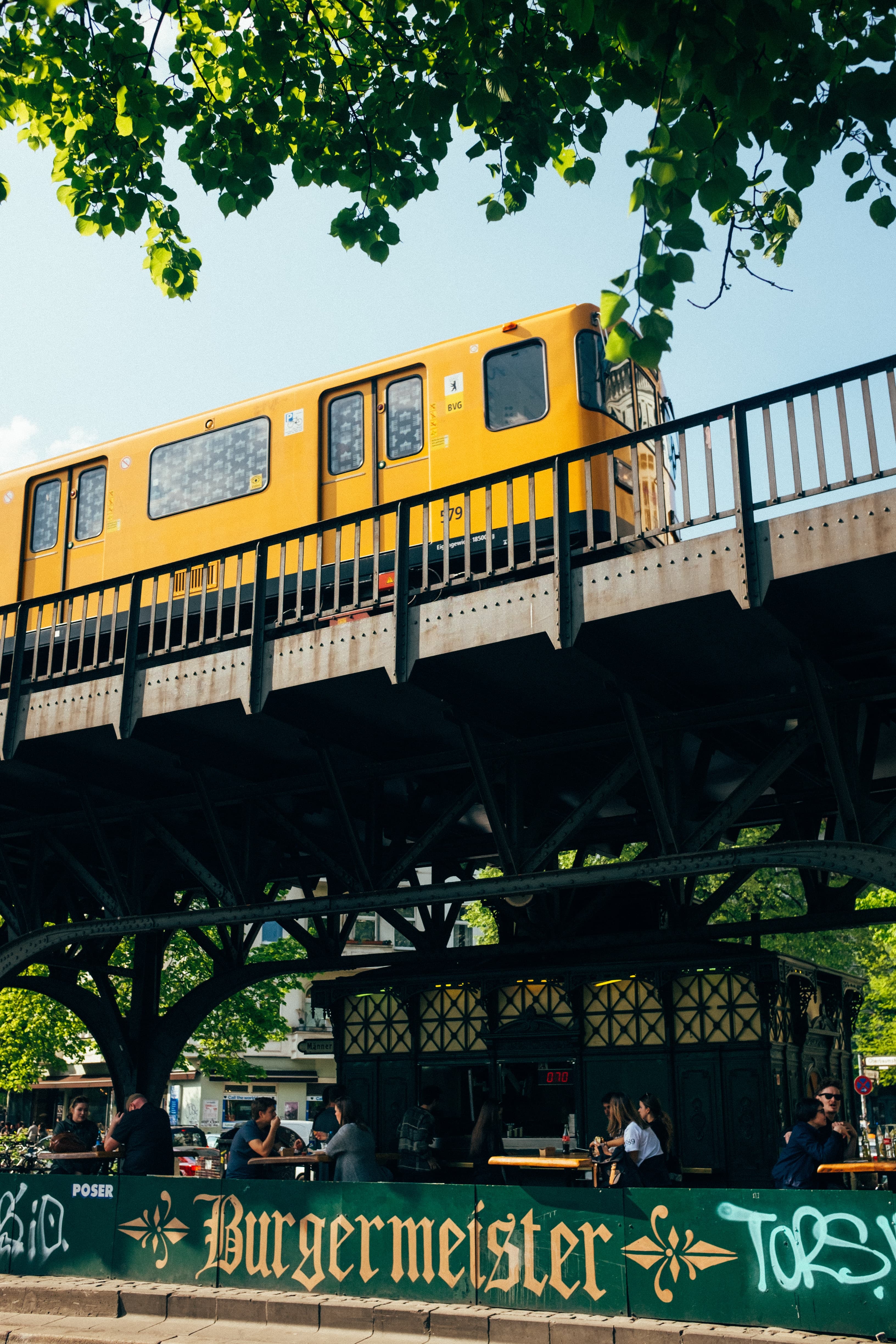 A yellow trail on a rail line in Berlin.