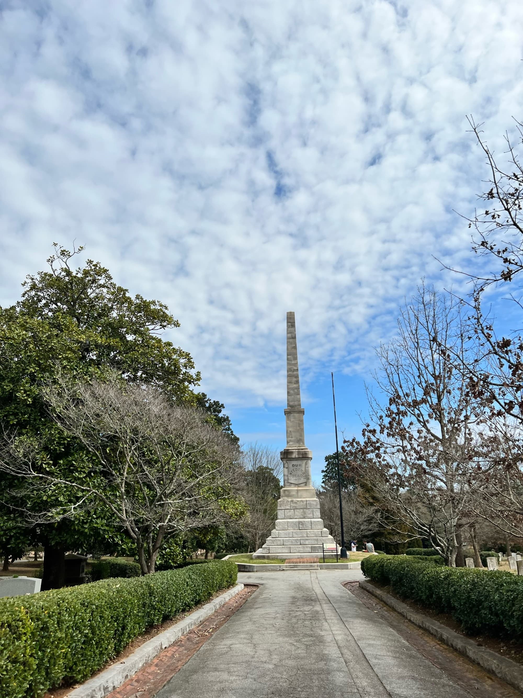 The monument stands tall and slender, with a pointed tip, prominently against the sky.
