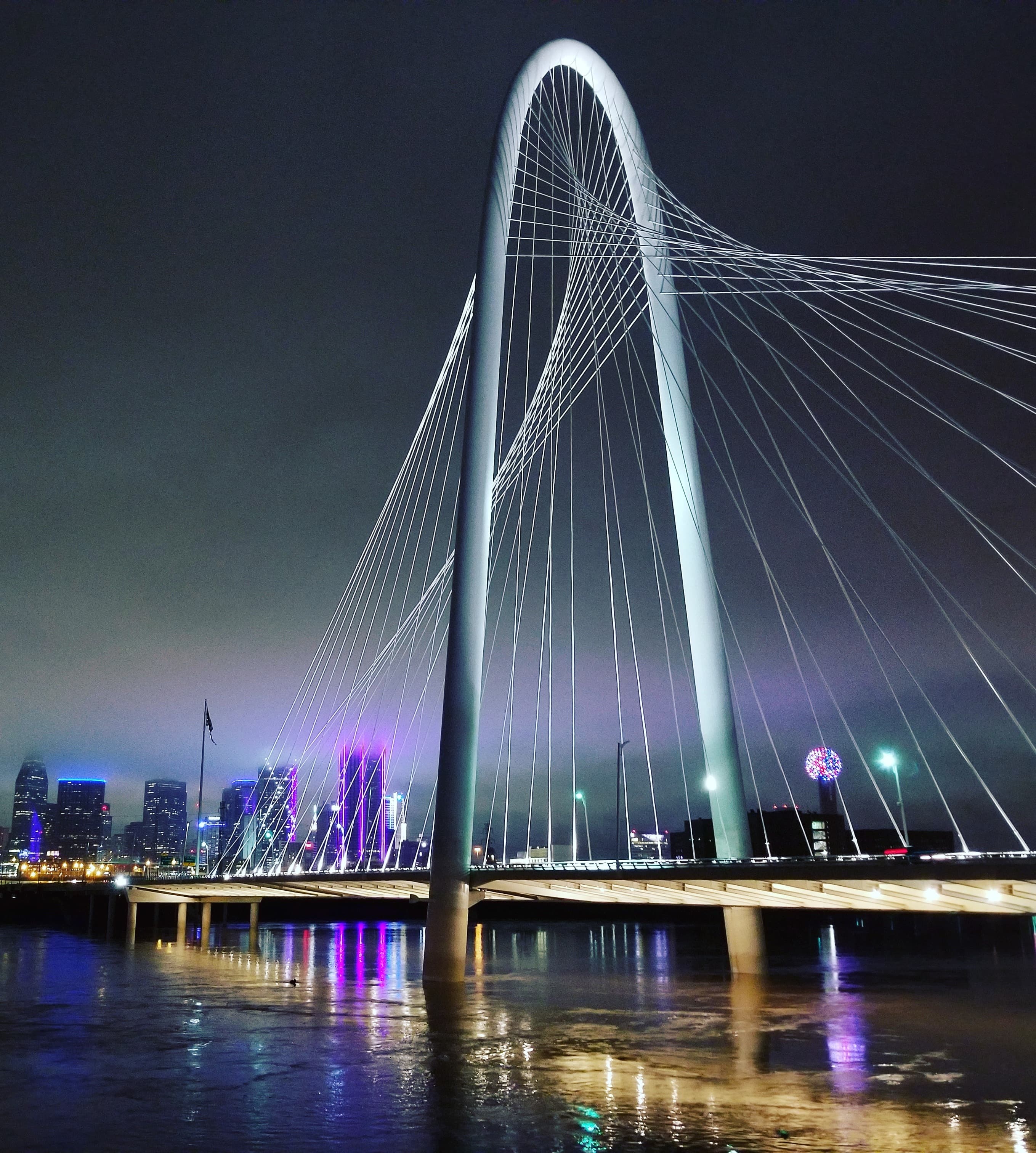 The Ronald Kirk Pedestrian Bridge is a stunning architectural landmark spanning the Trinity River in Dallas, Texas, offering pedestrians and cyclists picturesque views of the city's skyline.