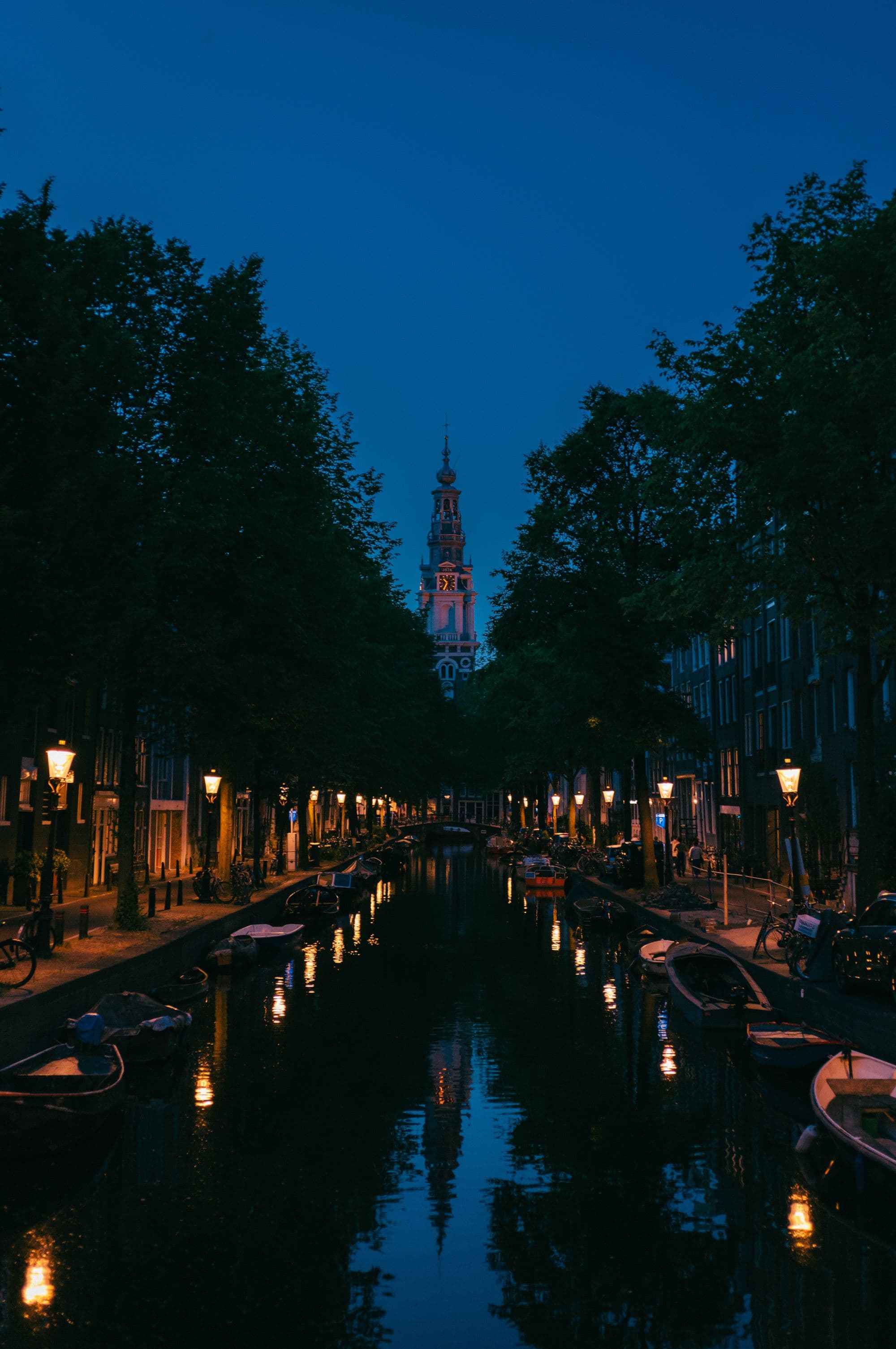 city on a narrow canal lit up at night