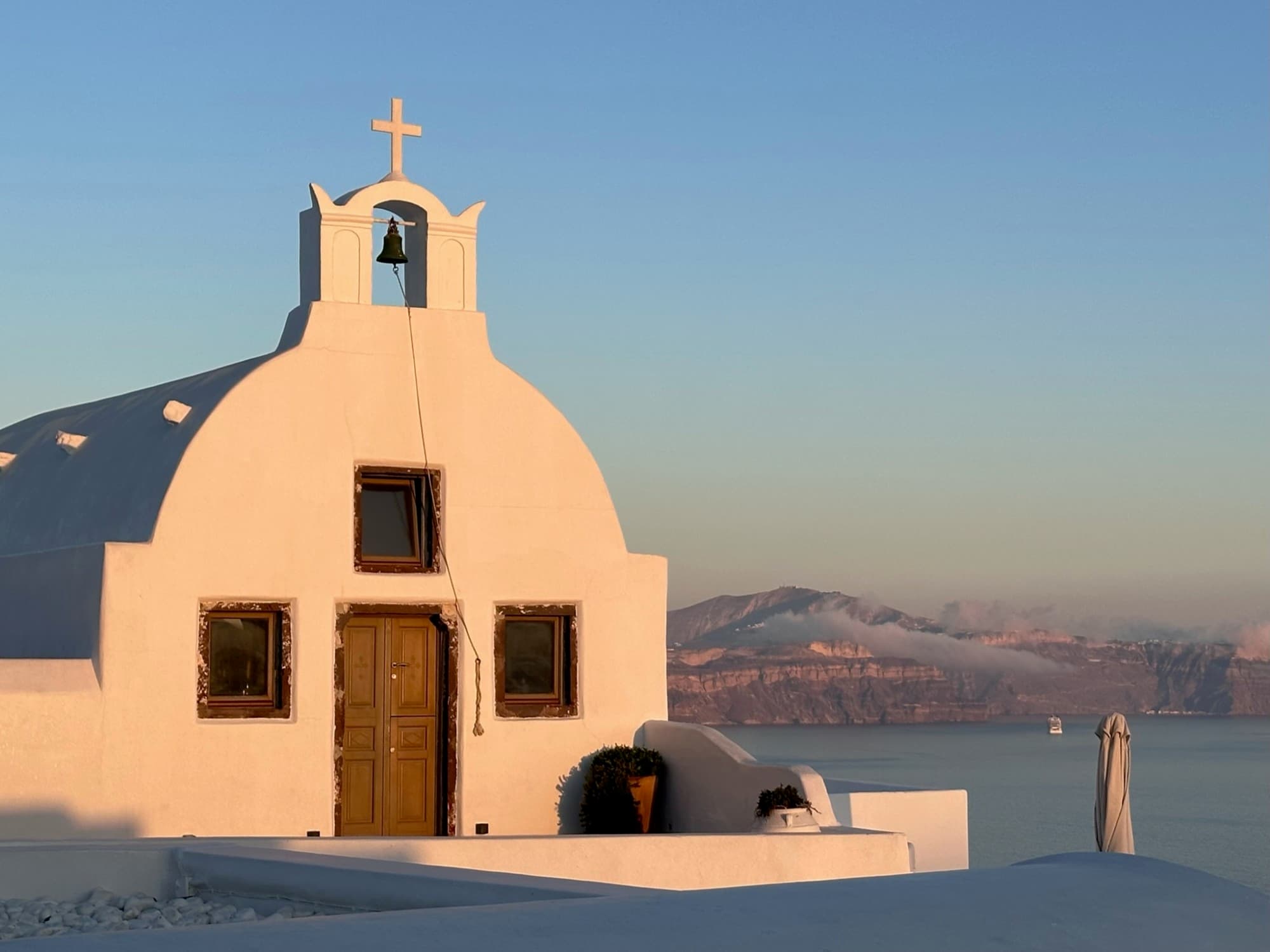 sun on building on the top of Greek island