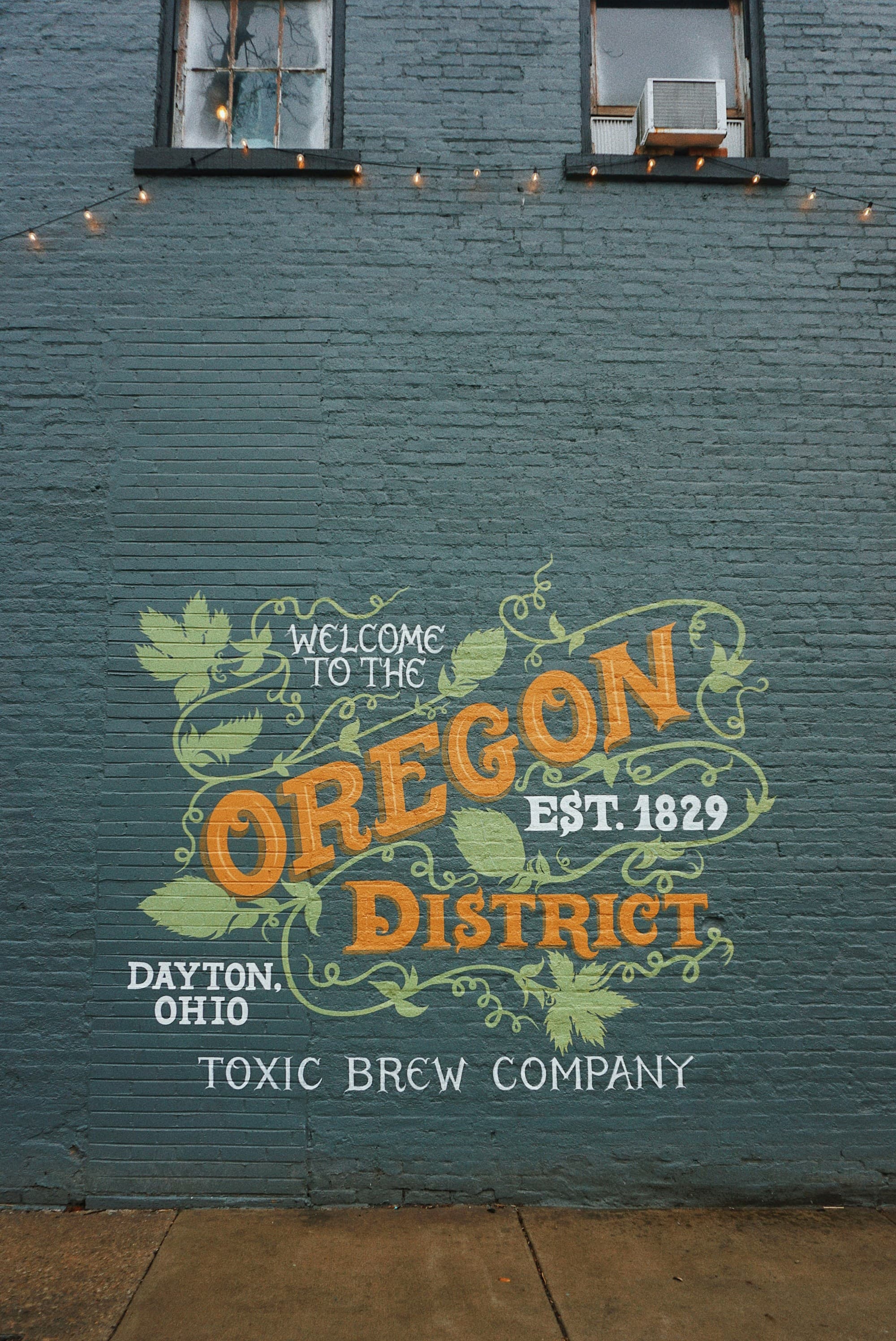 A picture of a painted wall saying Oregon District, Dayton, Ohio.