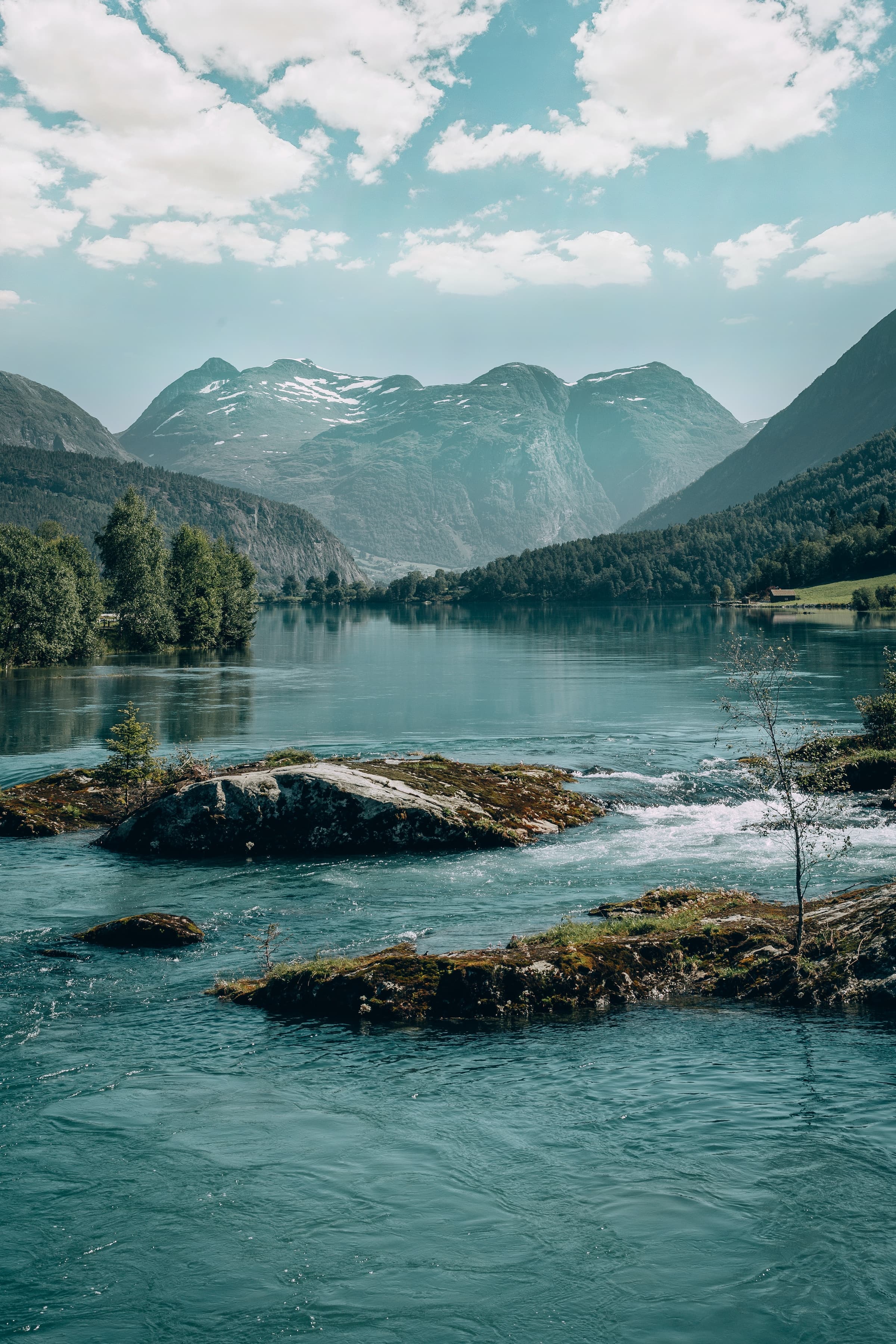 A view of water with mountains in the background in Norway.