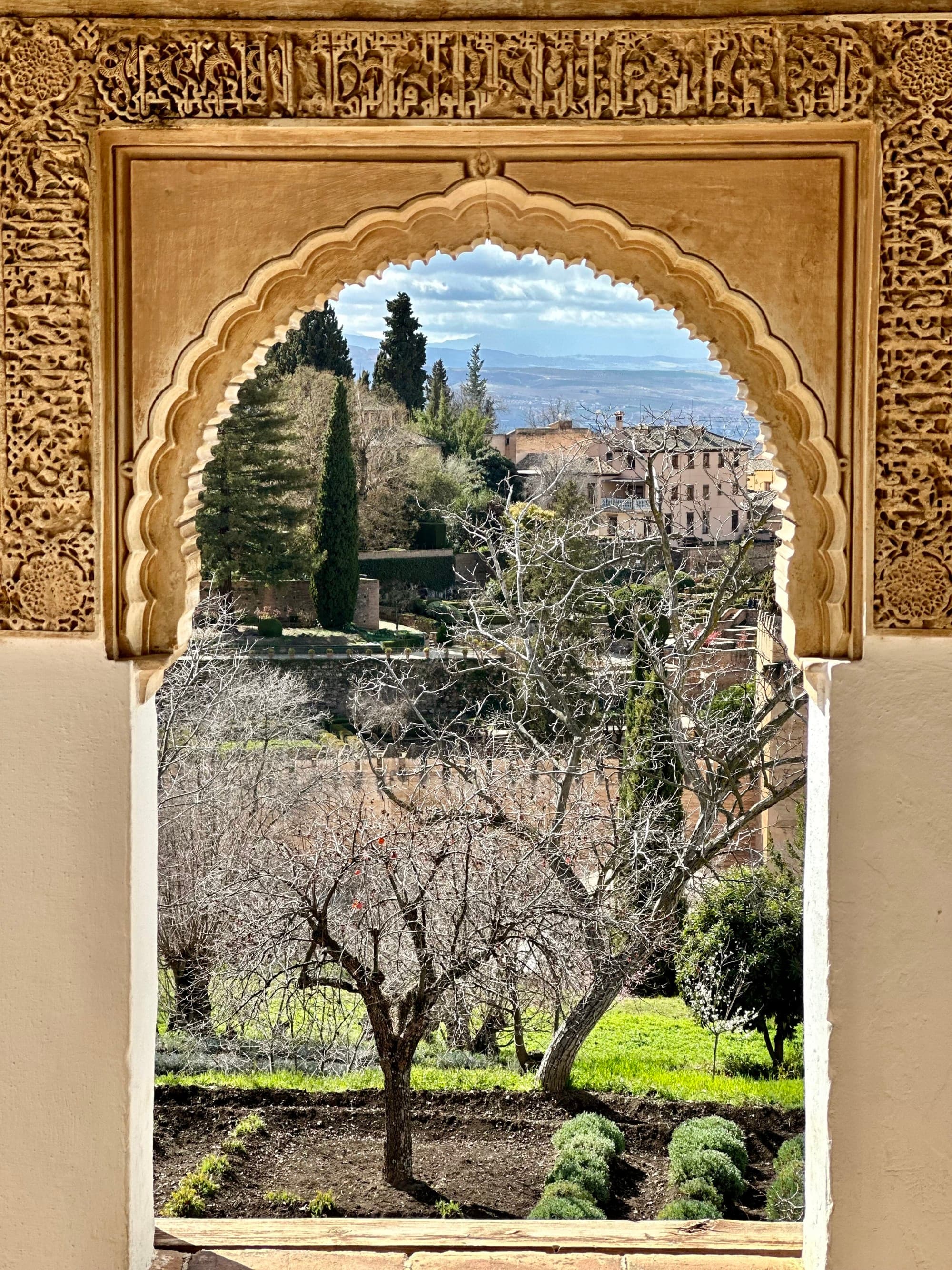 View of city from inside a golden arch.