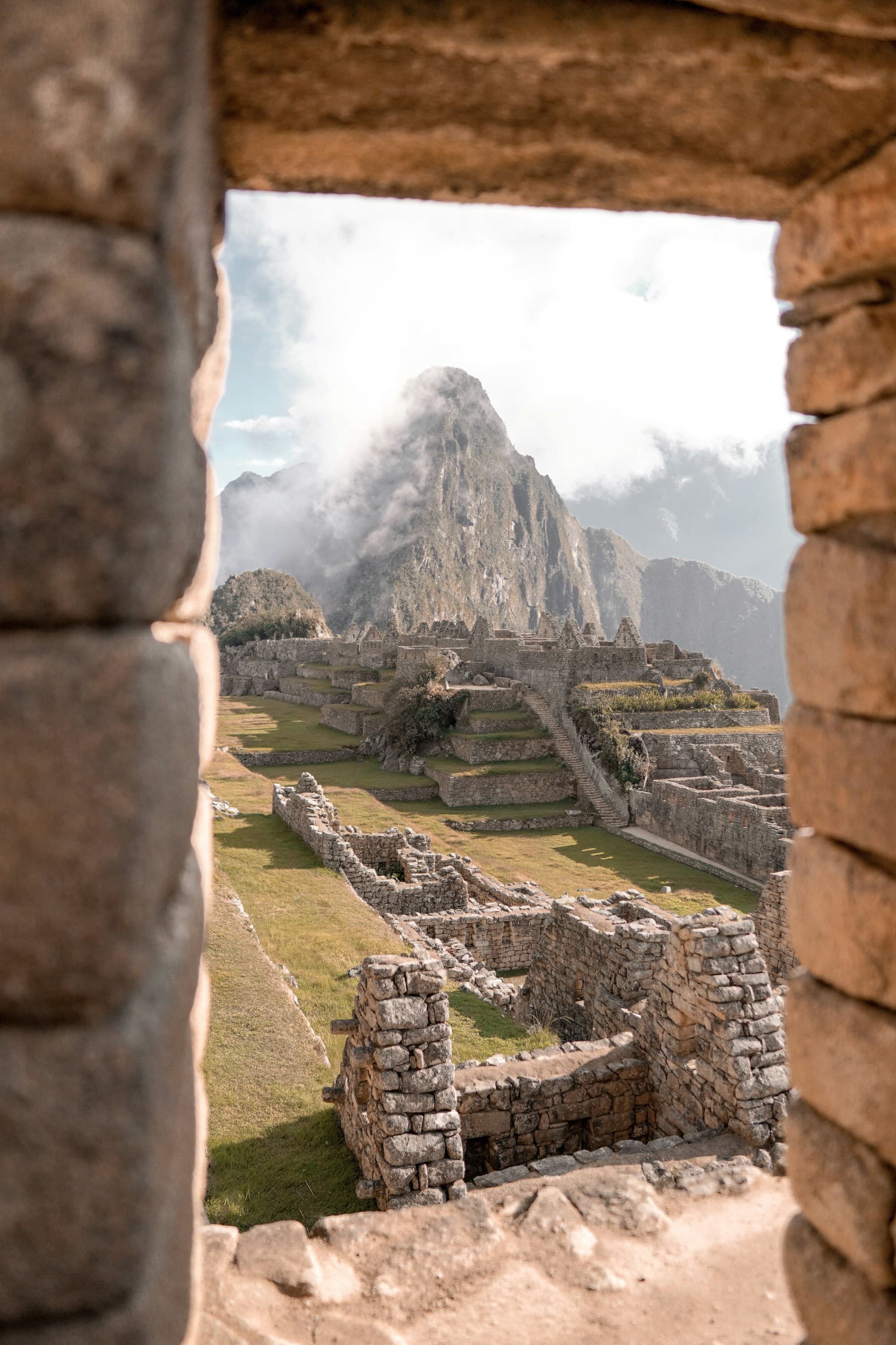 An image of Machu Picchu during the day: A timeless testament to Inca ingenuity, framed by the Andean peaks.