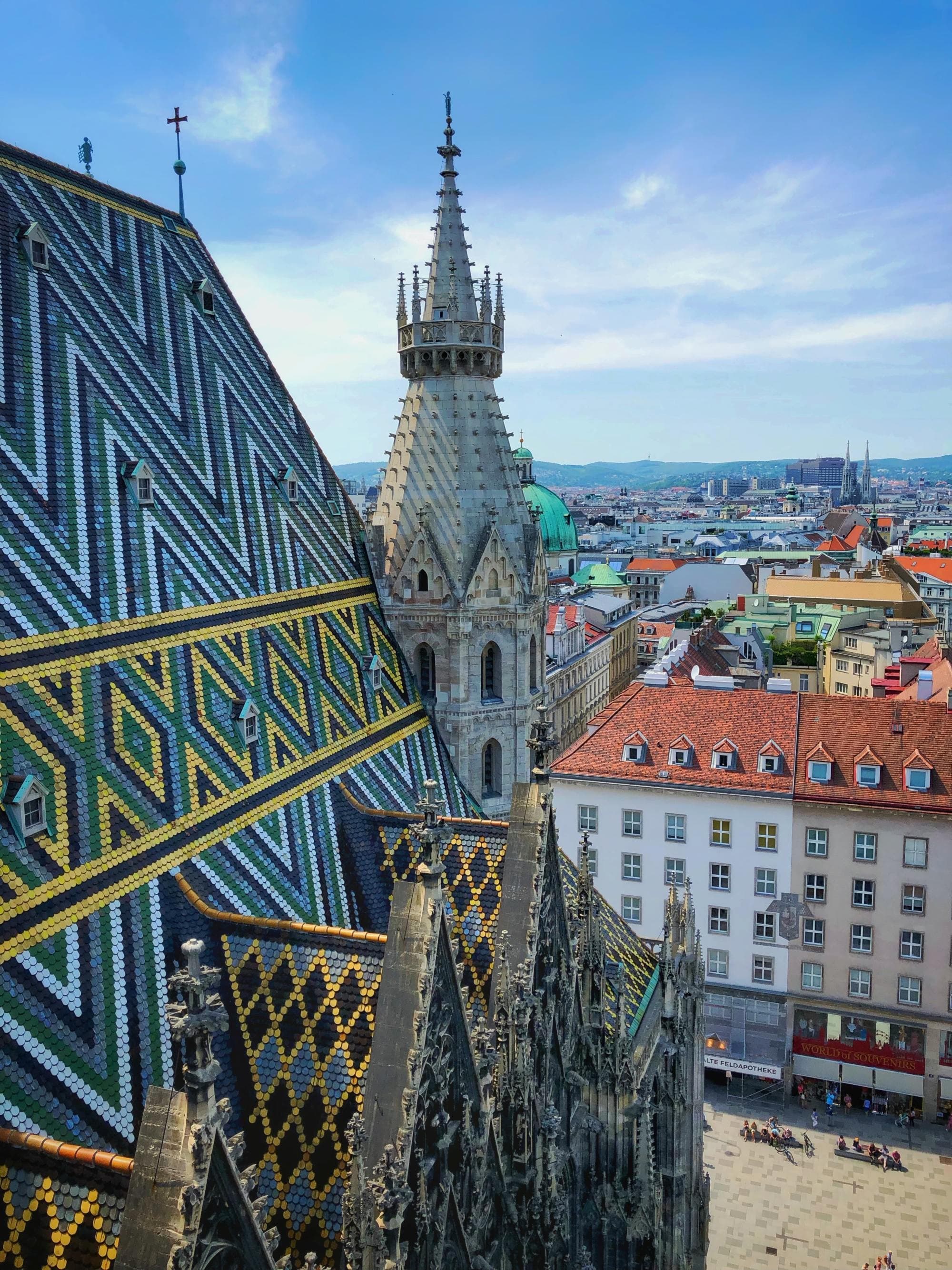 the varied and colorful rooftops of a historic city on a clear day